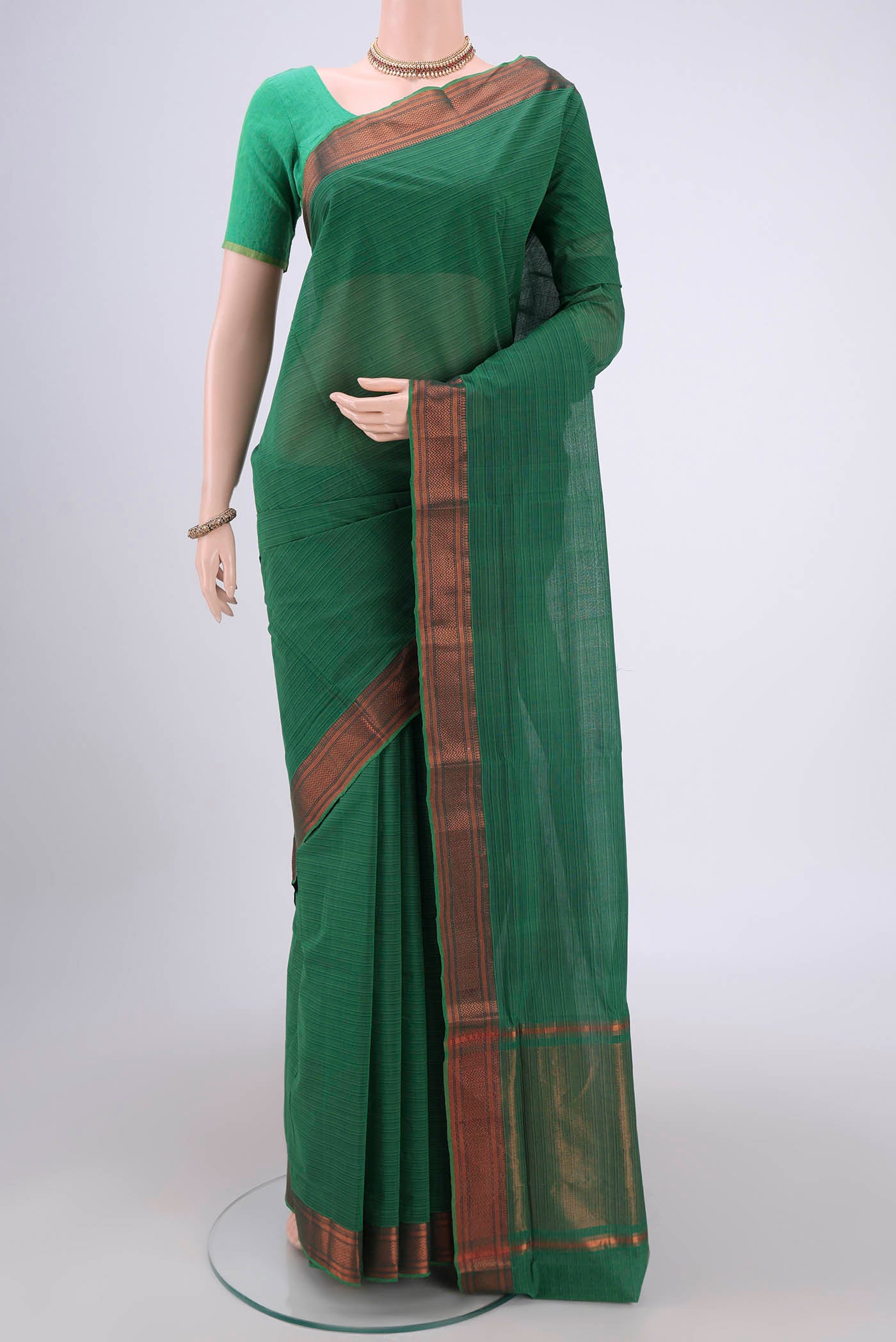 Green Mangalagiri Cotton Saree with Plain Body and Zari Border.  displayed on a mannequin