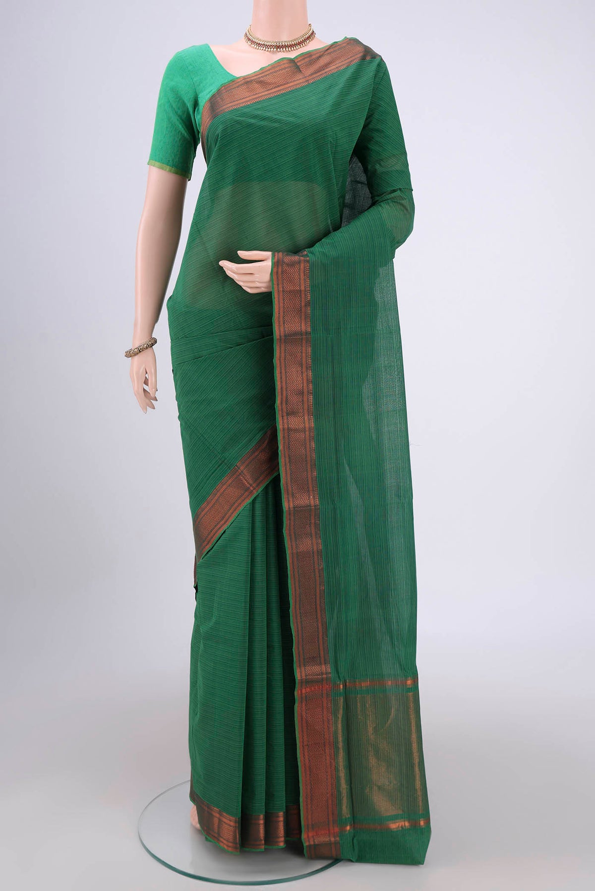 Green Mangalagiri Cotton Saree with Plain Body and Zari Border.  displayed on a mannequin