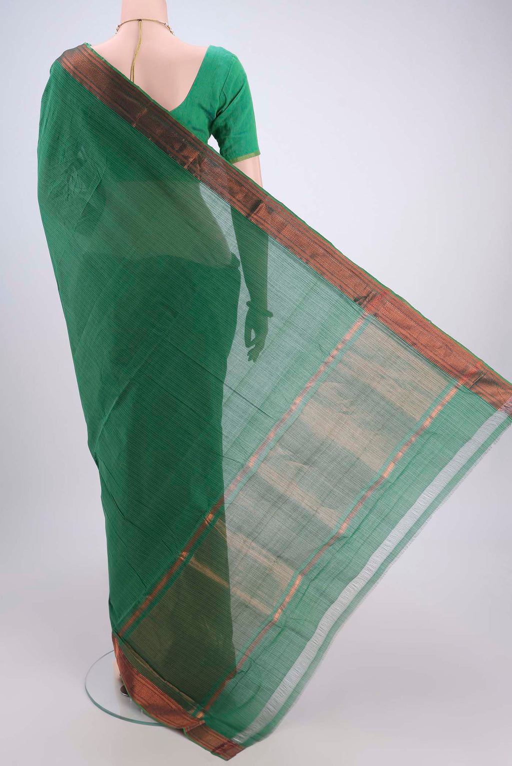 Flat view of Green Mangalagiri Cotton Saree with Plain Body and Zari Border. 