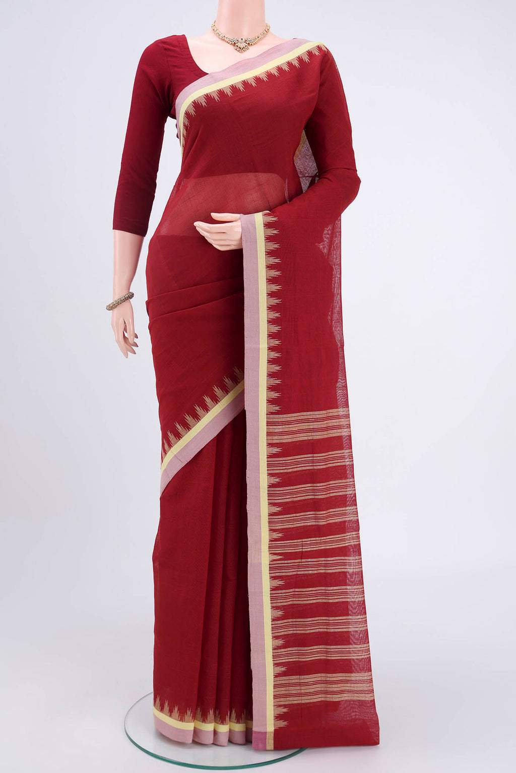 Maroon Mangalagiri Cotton Saree with Plain Body and Zari Border.  displayed on a mannequin