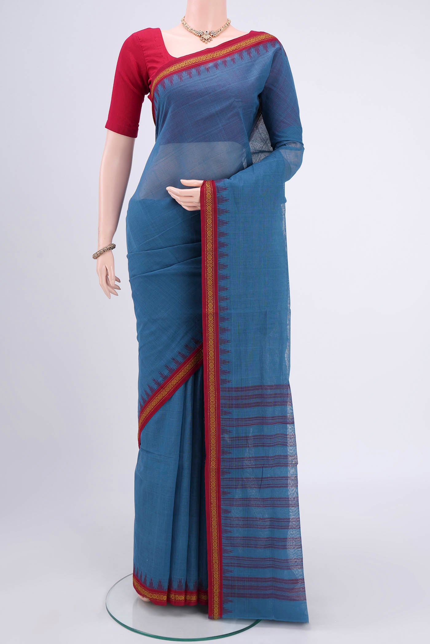 Light Blue Mangalagiri Cotton Saree with Plain Body and Thread Border.  displayed on a mannequin