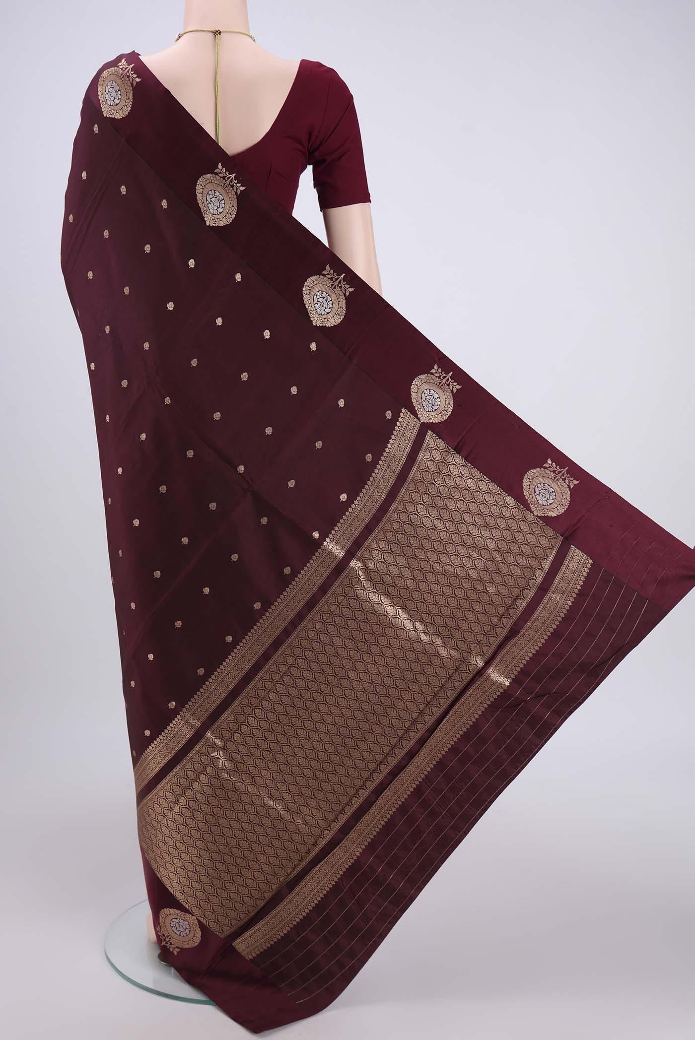 Flat view of Coffee Brown Banarasi Katan Silk Saree with Zari Butta on the body and Zari Border. 