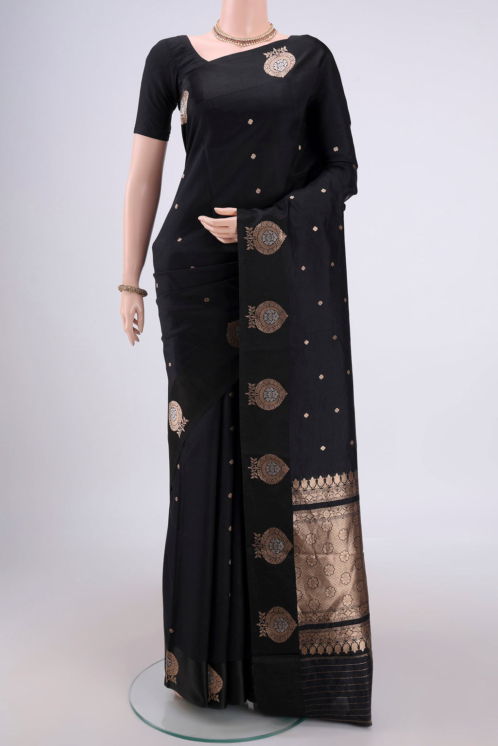 Black Banarasi Katan Silk Saree with Zari Butta on the body and Zari Border.  displayed on a mannequin