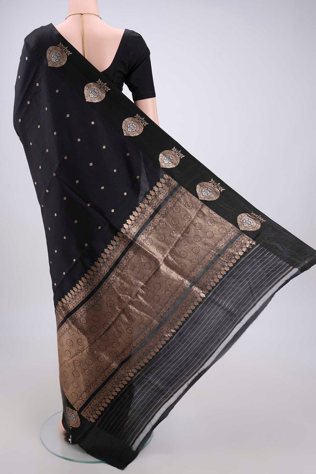 Flat view of Black Banarasi Katan Silk Saree with Zari Butta on the body and Zari Border. 