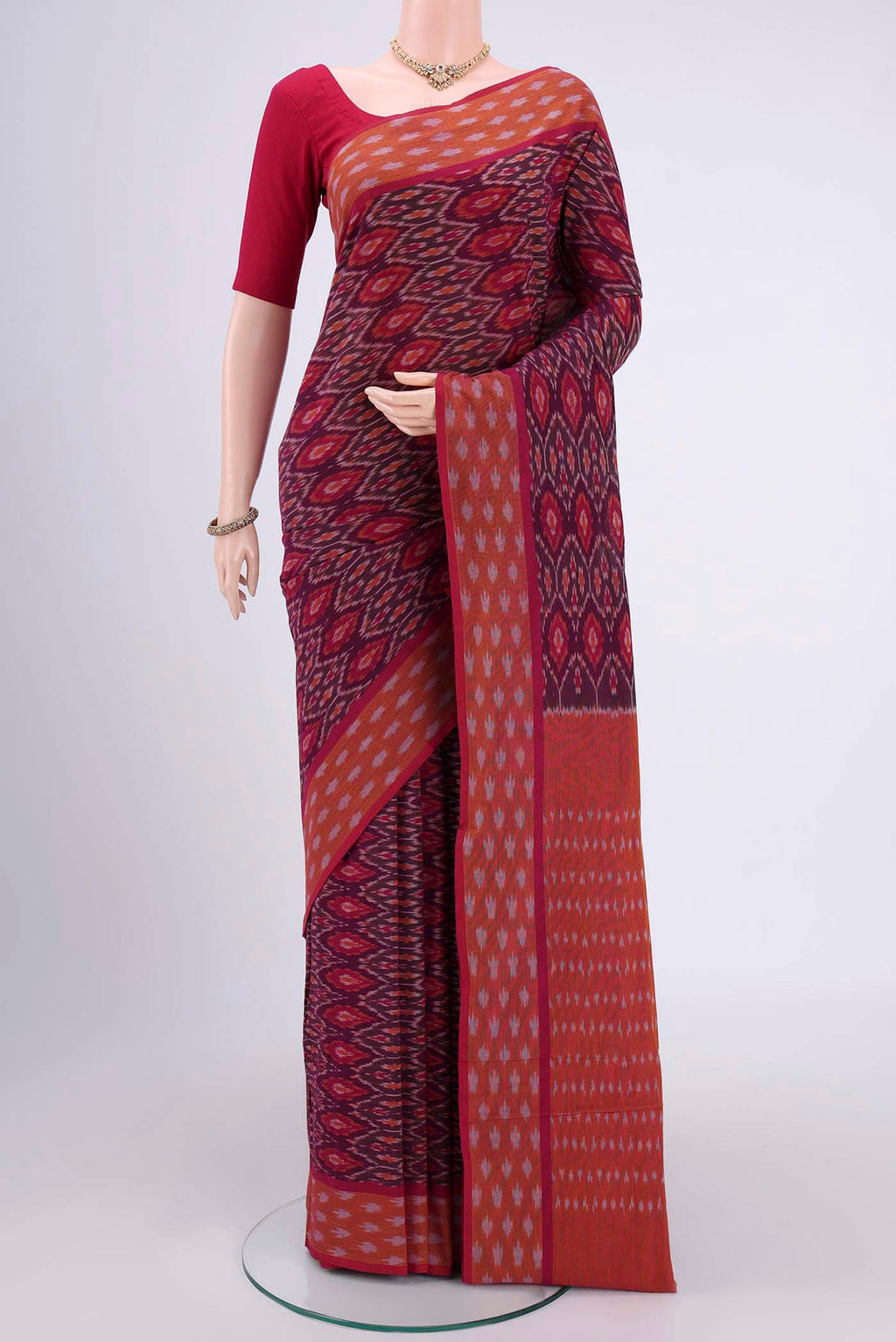 Magenta Dual Tone Pochampally Cotton Saree with Ikat design on the body and Ikat Border.  displayed on a mannequin