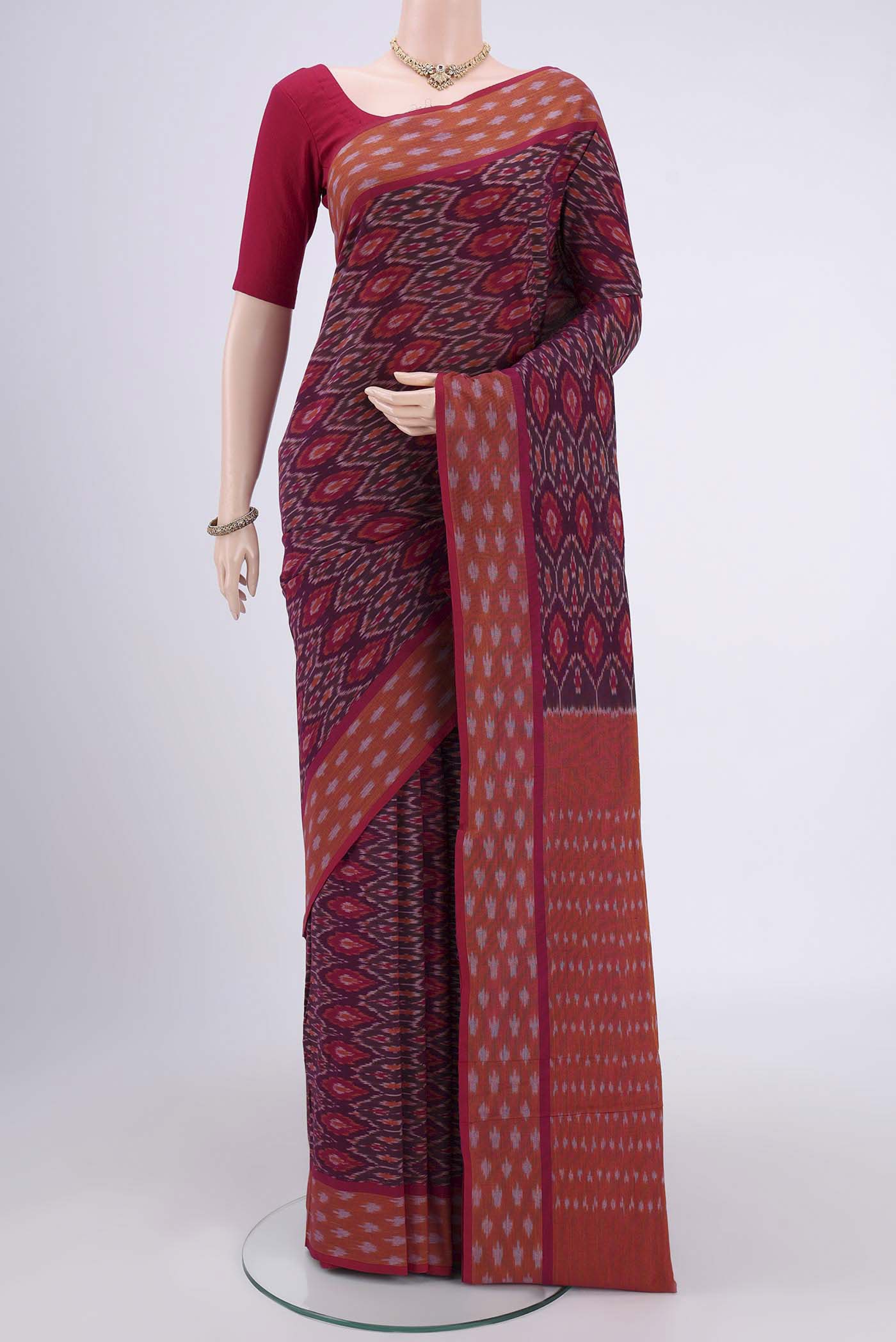 Magenta Dual Tone Pochampally Cotton Saree with Ikat design on the body and Ikat Border.  displayed on a mannequin