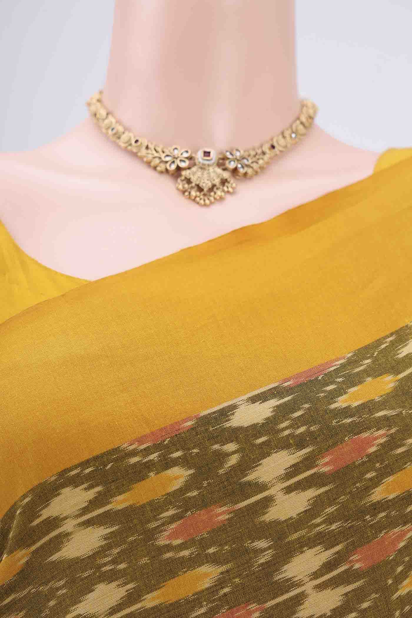 Border image of Mehandi Green Pochampally Cotton Saree with Ikat design on the body and Ikat Border. 