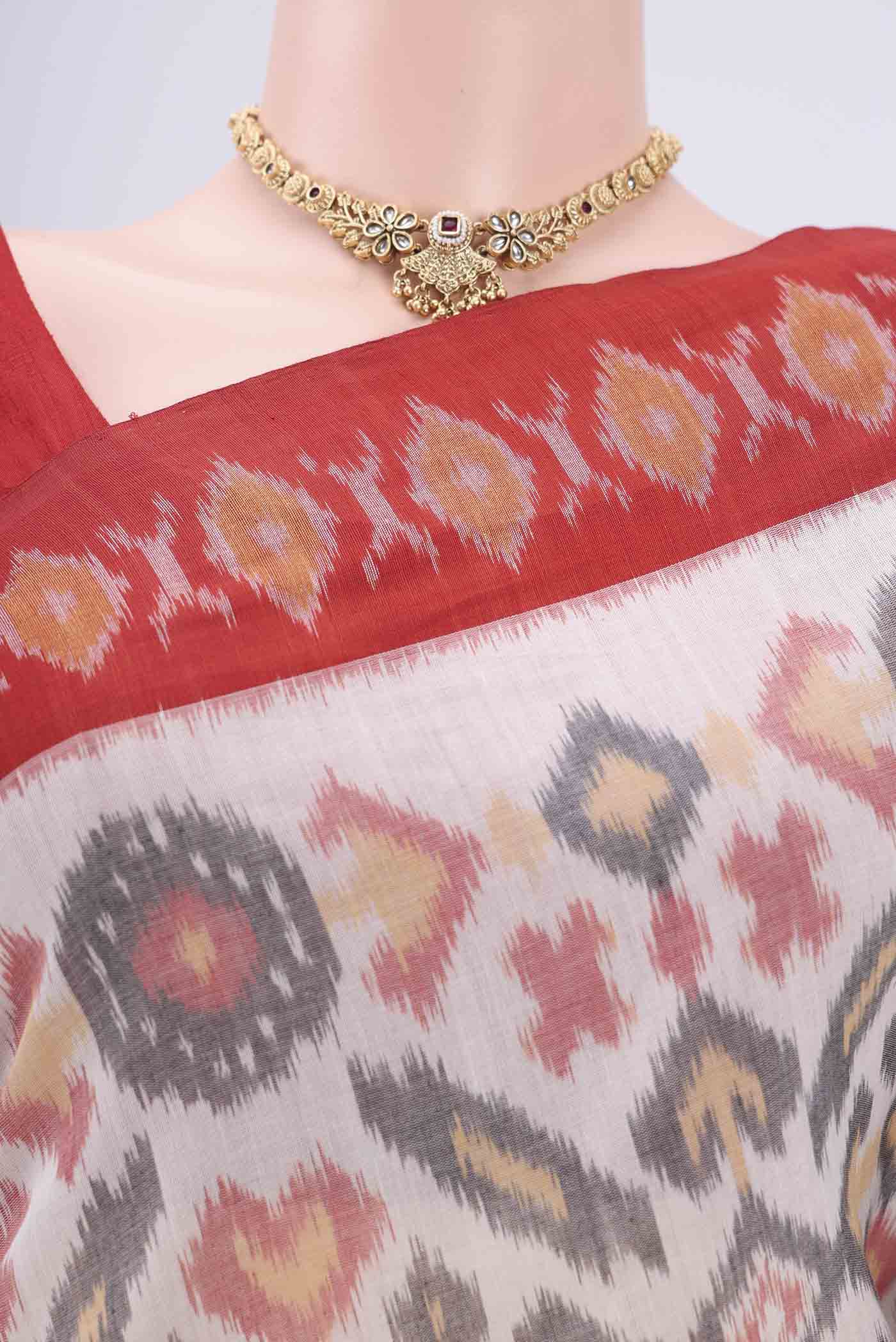 Border image of White Pochampally Cotton Saree with Ikat design on the body and Ikat Border. 