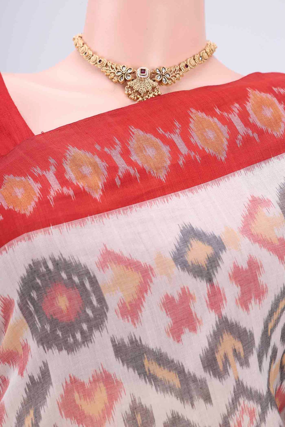Border image of White Pochampally Cotton Saree with Ikat design on the body and Ikat Border. 