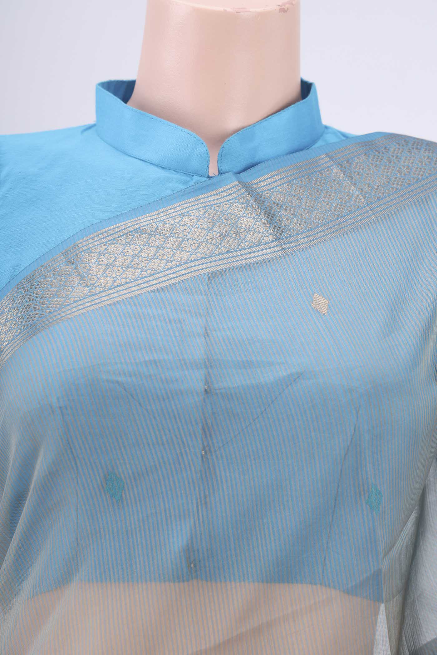 Border image of Beige Maheshwari Silk Cotton Saree with Zari And Thread Butta on the body and Zari Border. 