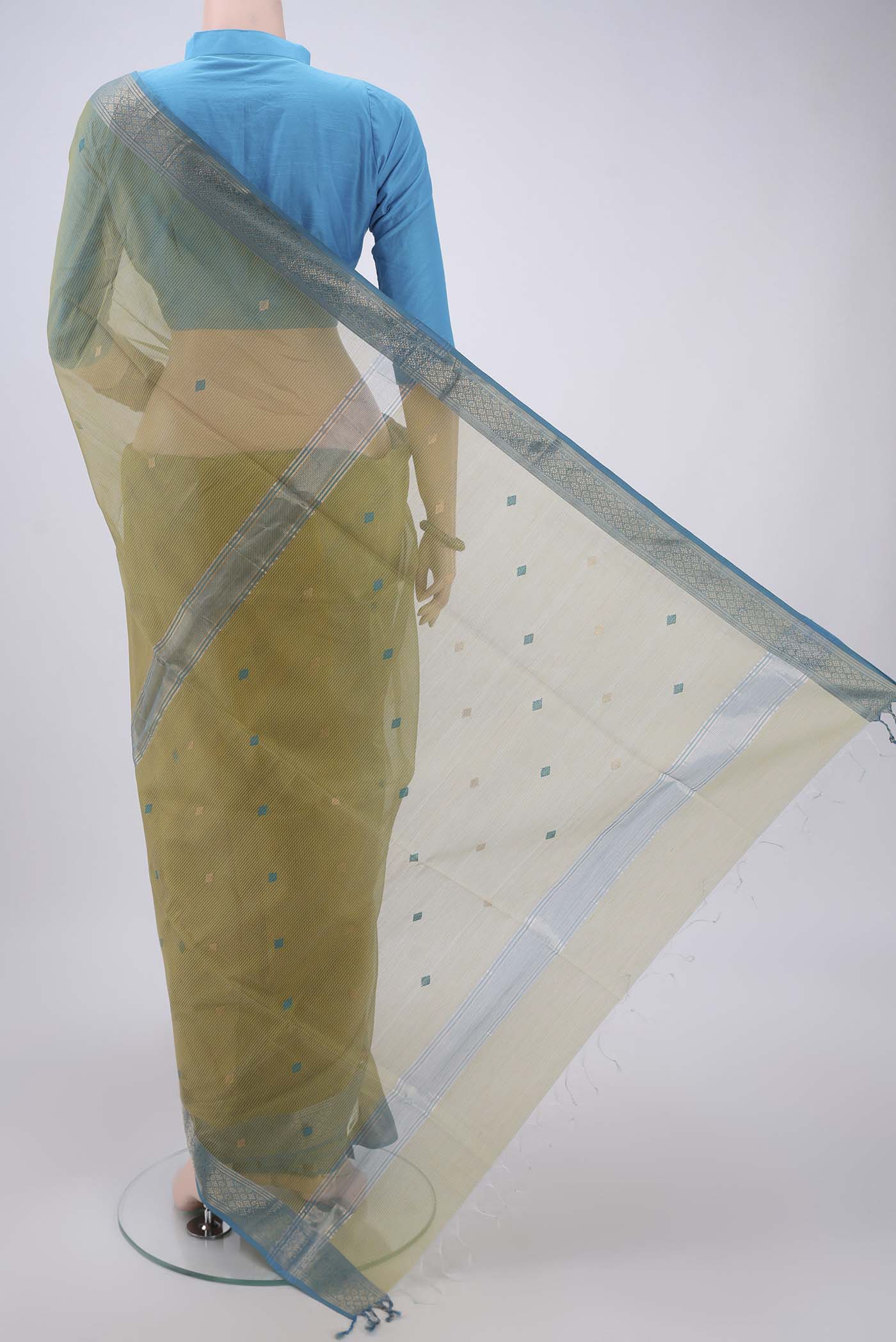 Flat view of Yellow Maheshwari Silk Cotton Saree with Zari And Thread Butta on the body and Zari Border. 