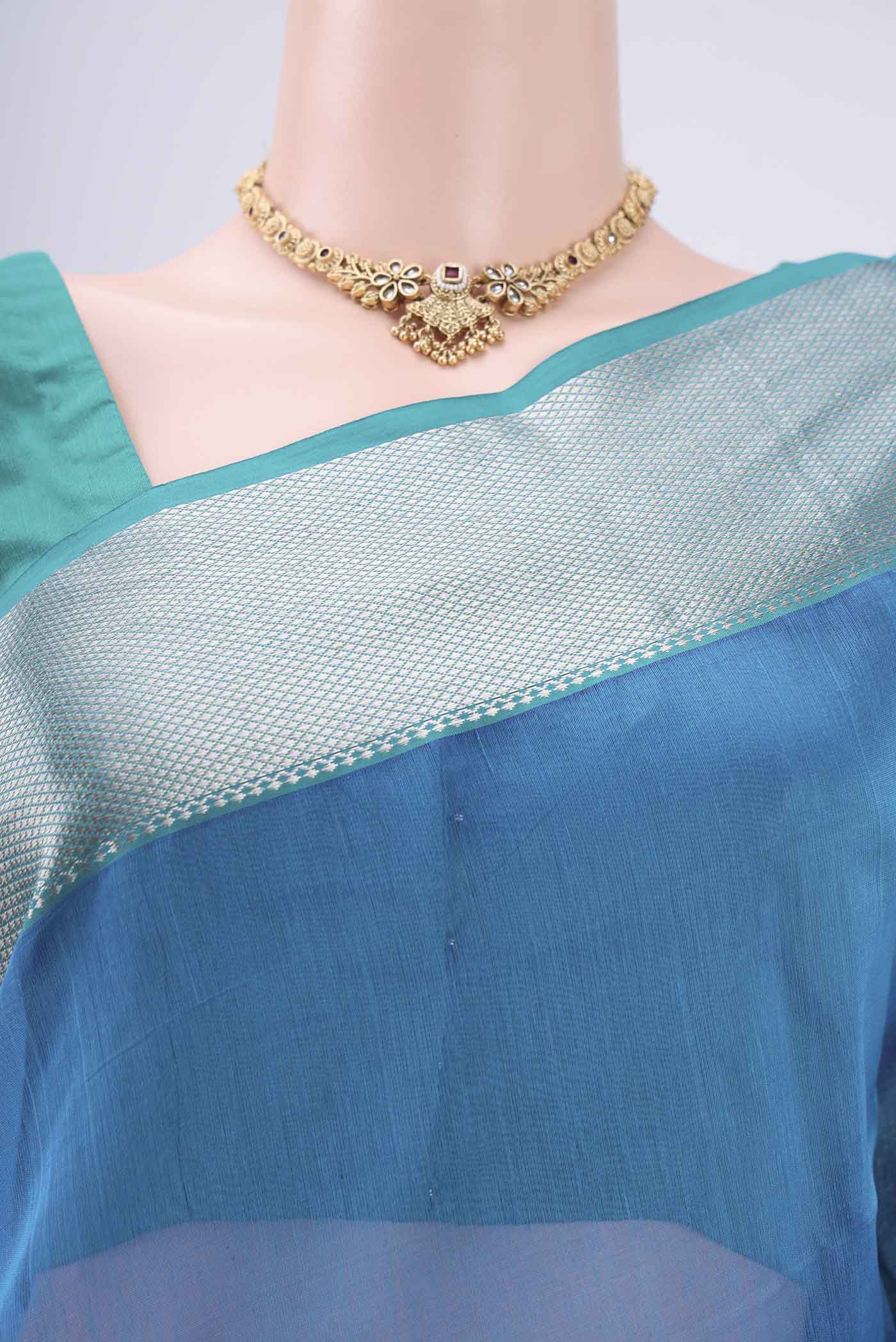 Border image of Turquoise Maheshwari Silk Cotton Saree with Plain Body and Zari Border. 