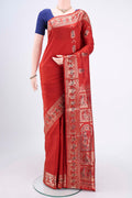Rust Baluchari Silk Saree with Zari And Thread Butta on the body and Zari And Thread Border.  displayed on a mannequin
