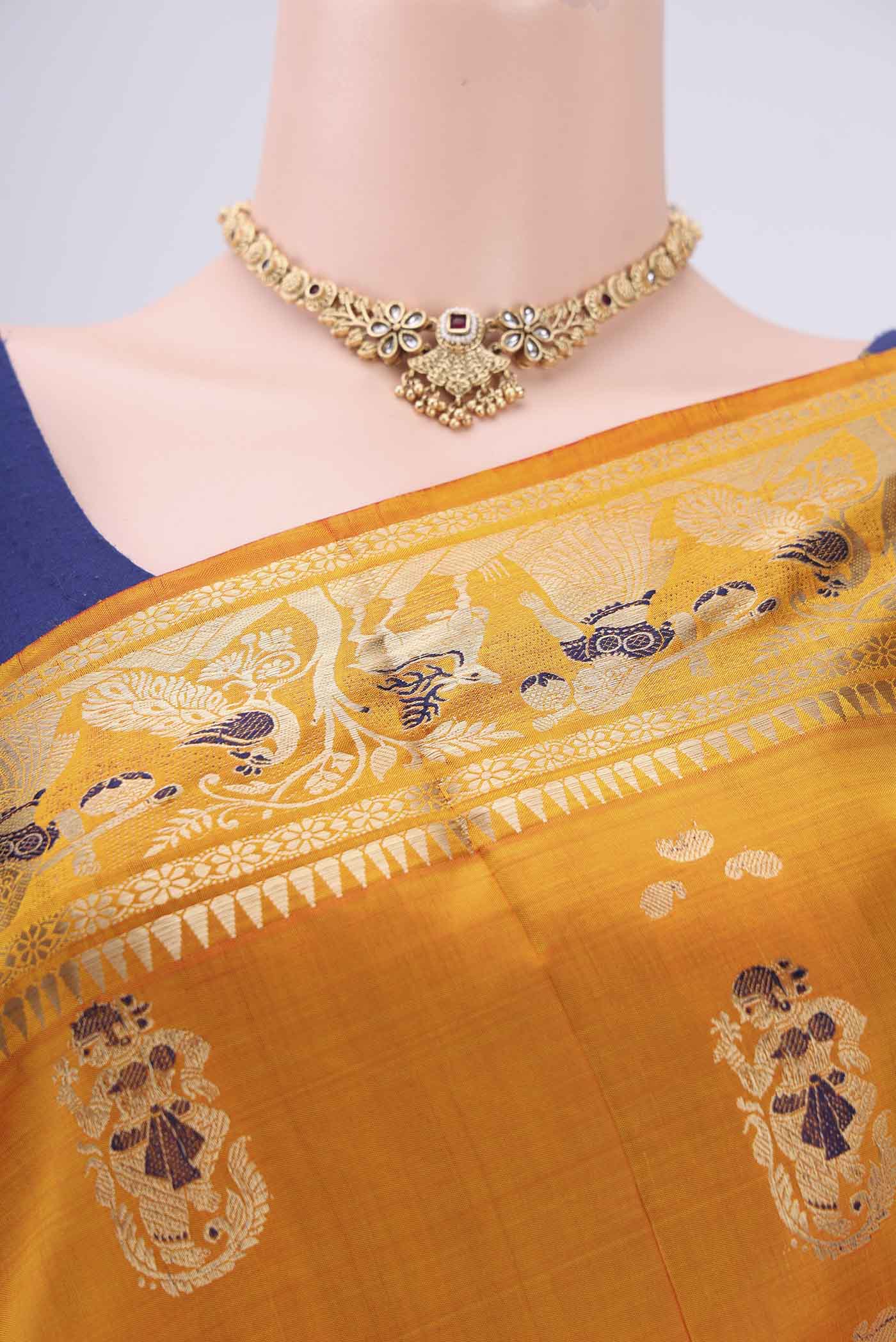 Border image of Orange Baluchari Silk Saree with Zari And Thread Butta on the body and Zari And Thread Border. 