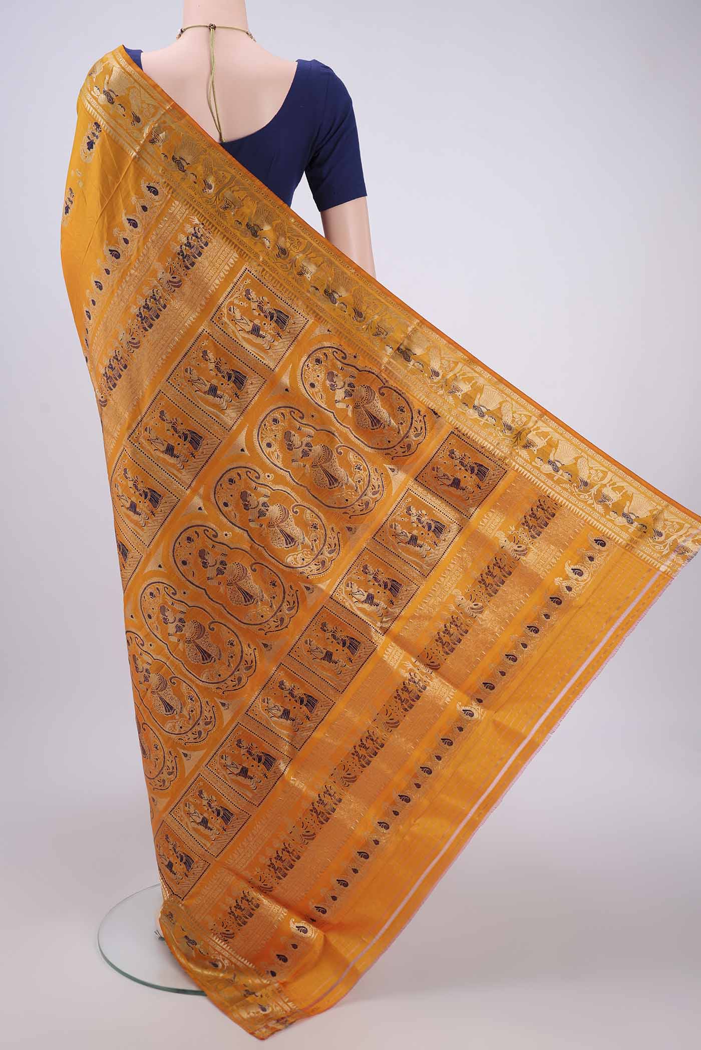 Flat view of Orange Baluchari Silk Saree with Zari And Thread Butta on the body and Zari And Thread Border. 