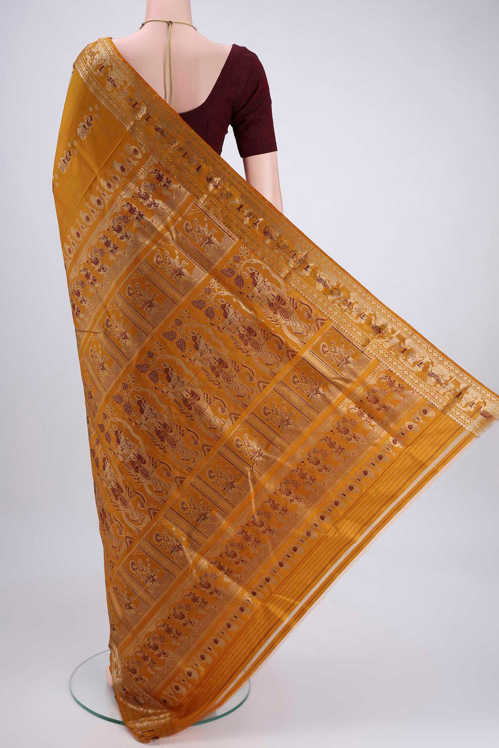 Flat view of Mustard Baluchari Silk Saree with Zari And Thread Butta on the body and Zari And Thread Border. 