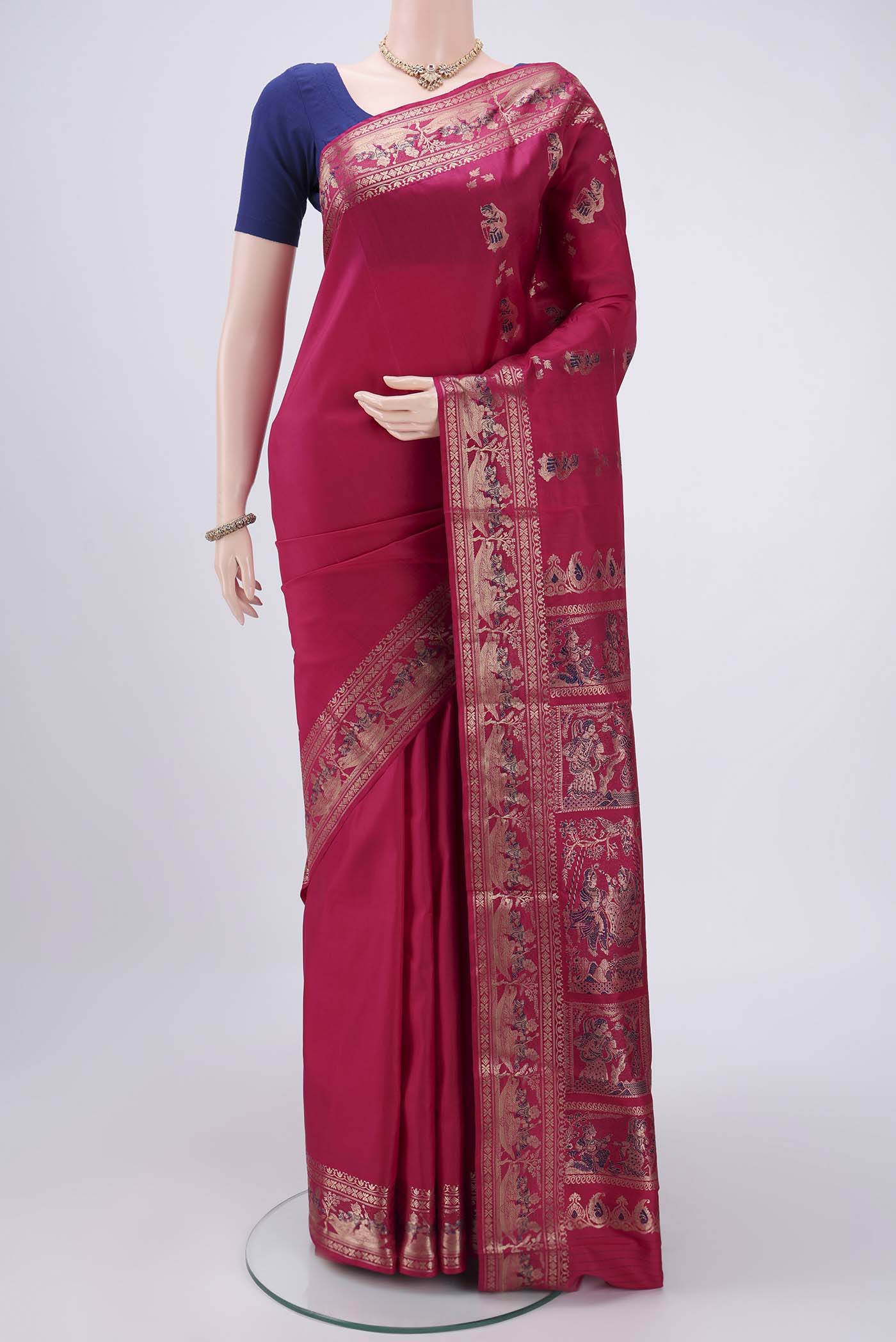 Rani Pink Baluchari Silk Saree with Zari And Thread Butta on the body and Zari And Thread Border.  displayed on a mannequin