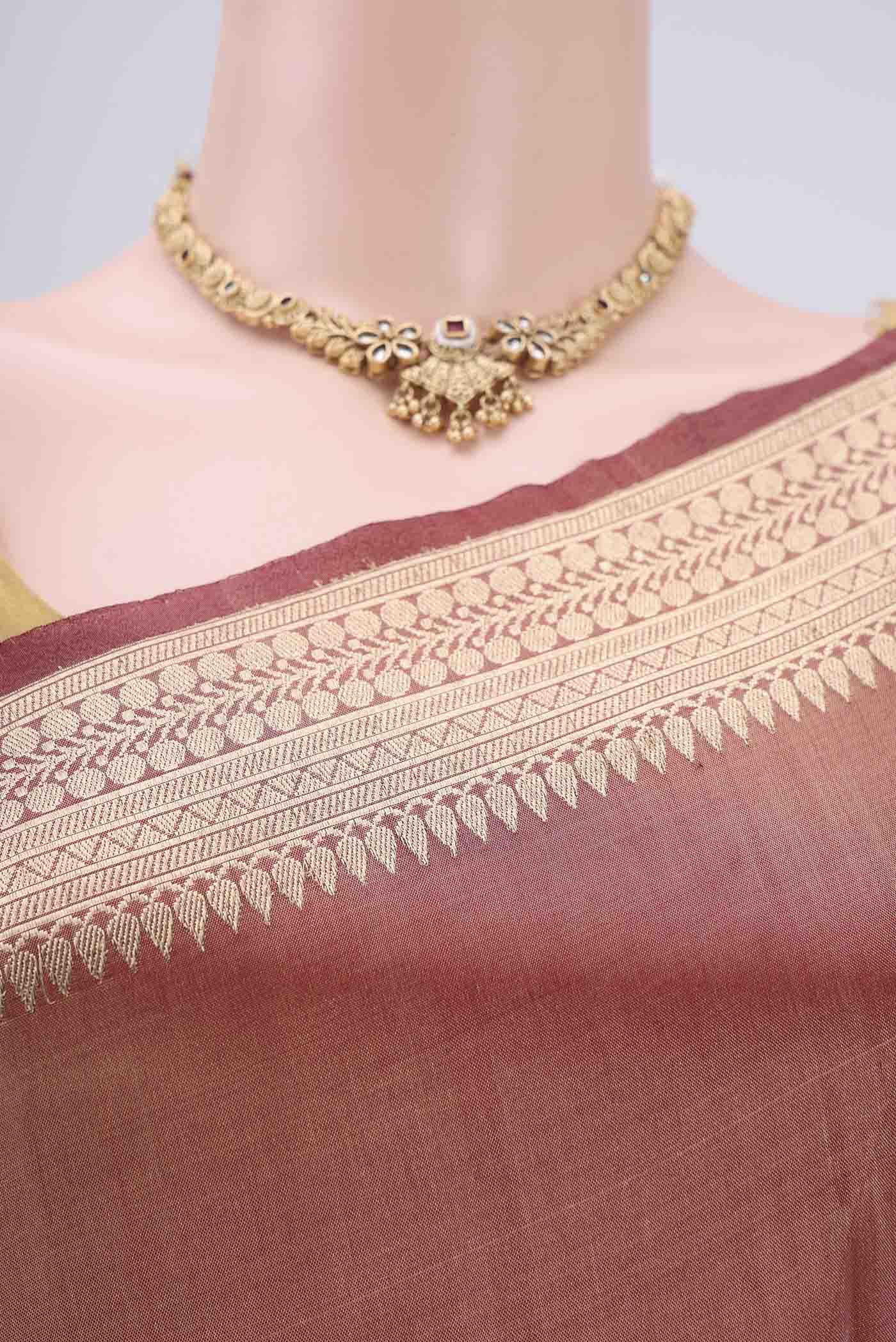 Border image of Maroon Banarasi Tissue Silk Saree with Zari Butta on the body and Zari Border. 