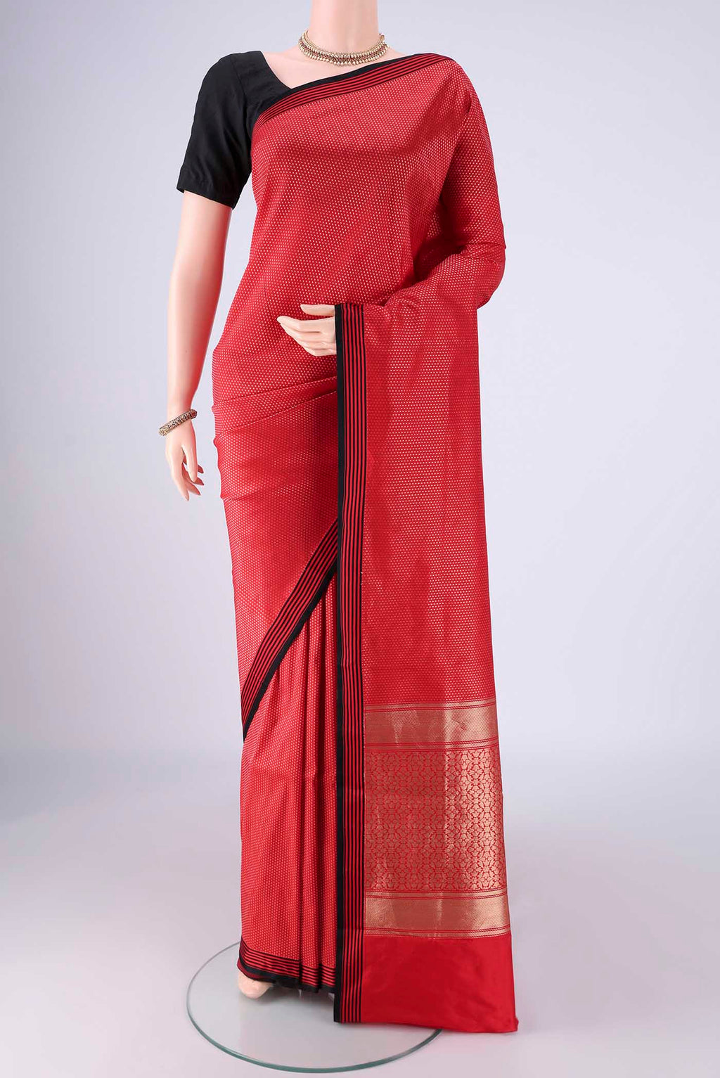 Red Banarasi Silk Saree with Zari Brocade on the body and Plain Border.  displayed on a mannequin