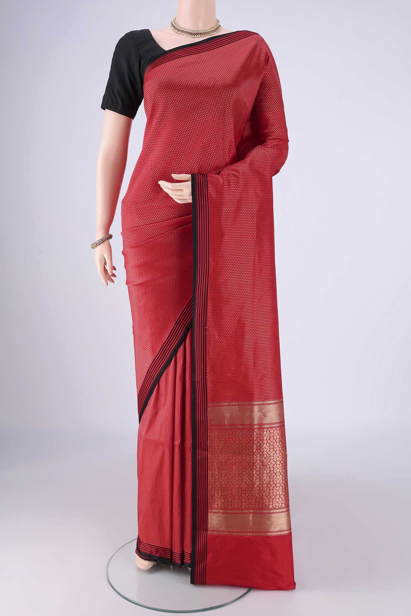Red Banarasi Silk Saree with Zari Brocade on the body and Plain Border.  displayed on a mannequin