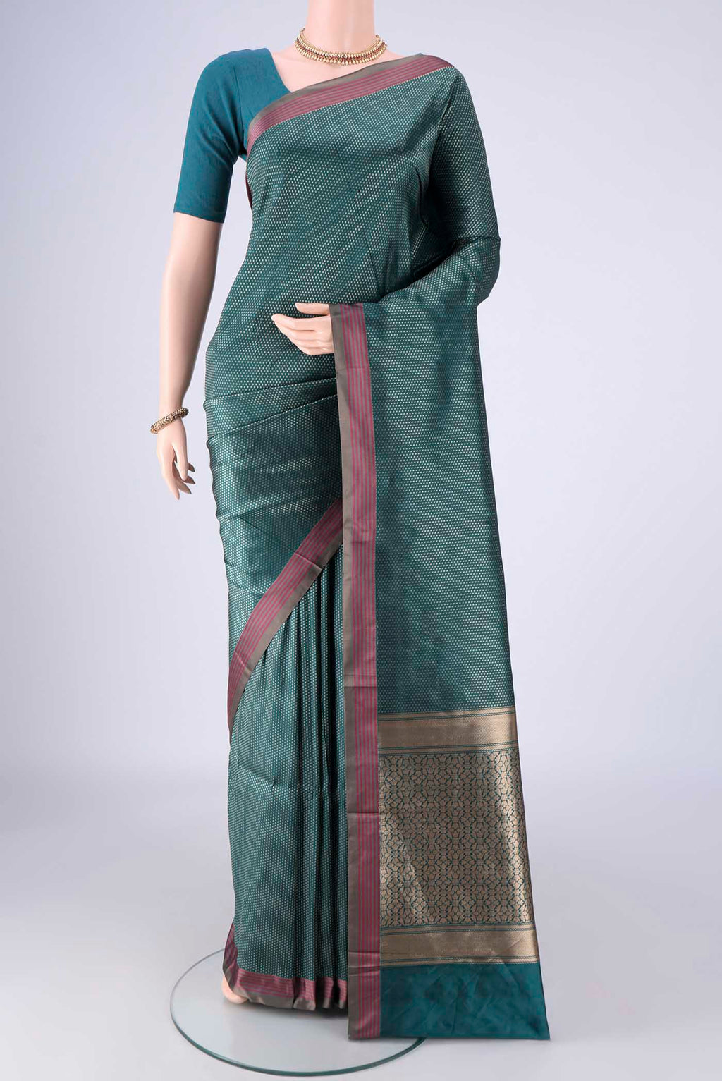 Peacock Blue Banarasi Silk Saree with Zari Brocade on the body and Plain Border.  displayed on a mannequin