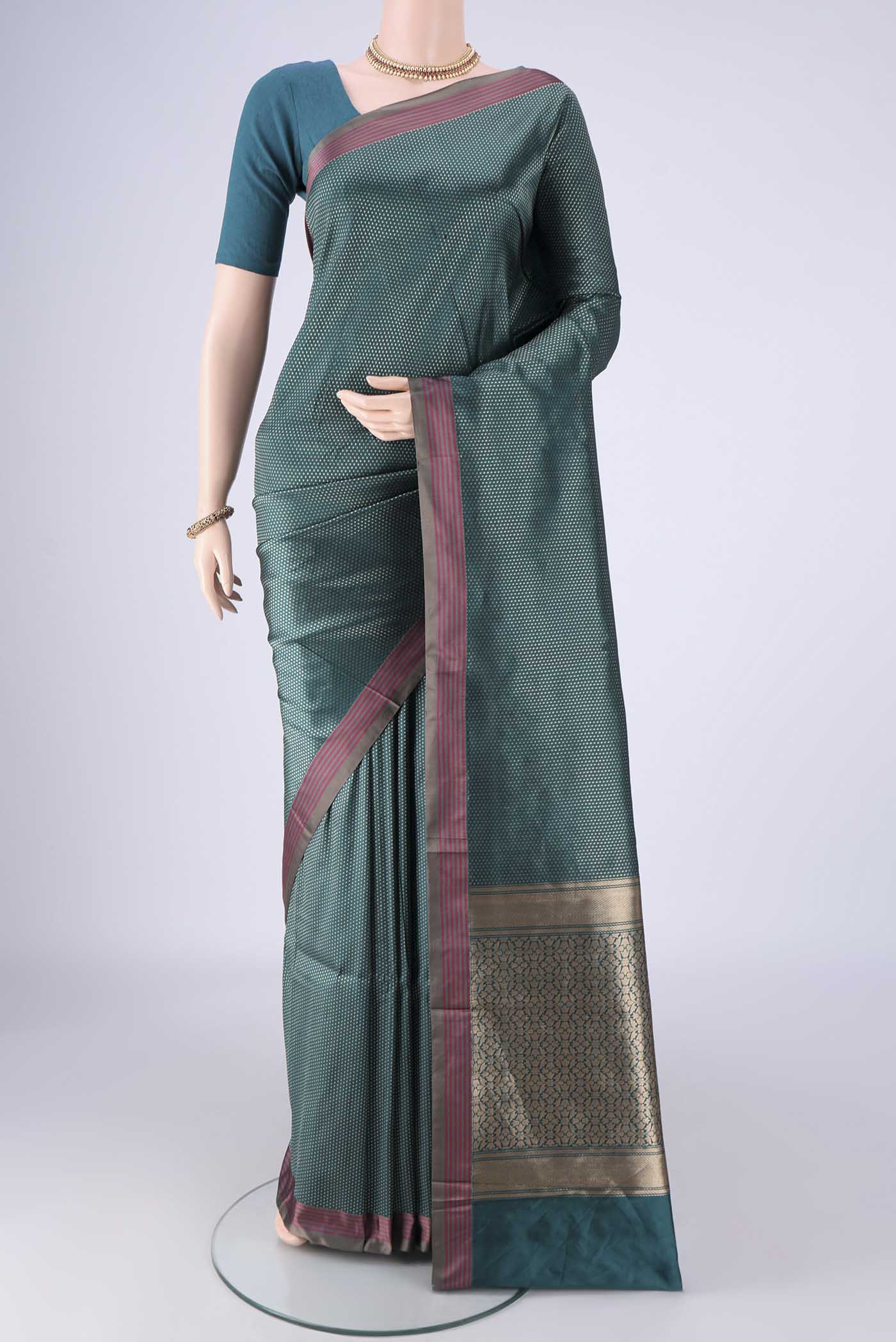 Peacock Blue Banarasi Silk Saree with Zari Brocade on the body and Plain Border.  displayed on a mannequin