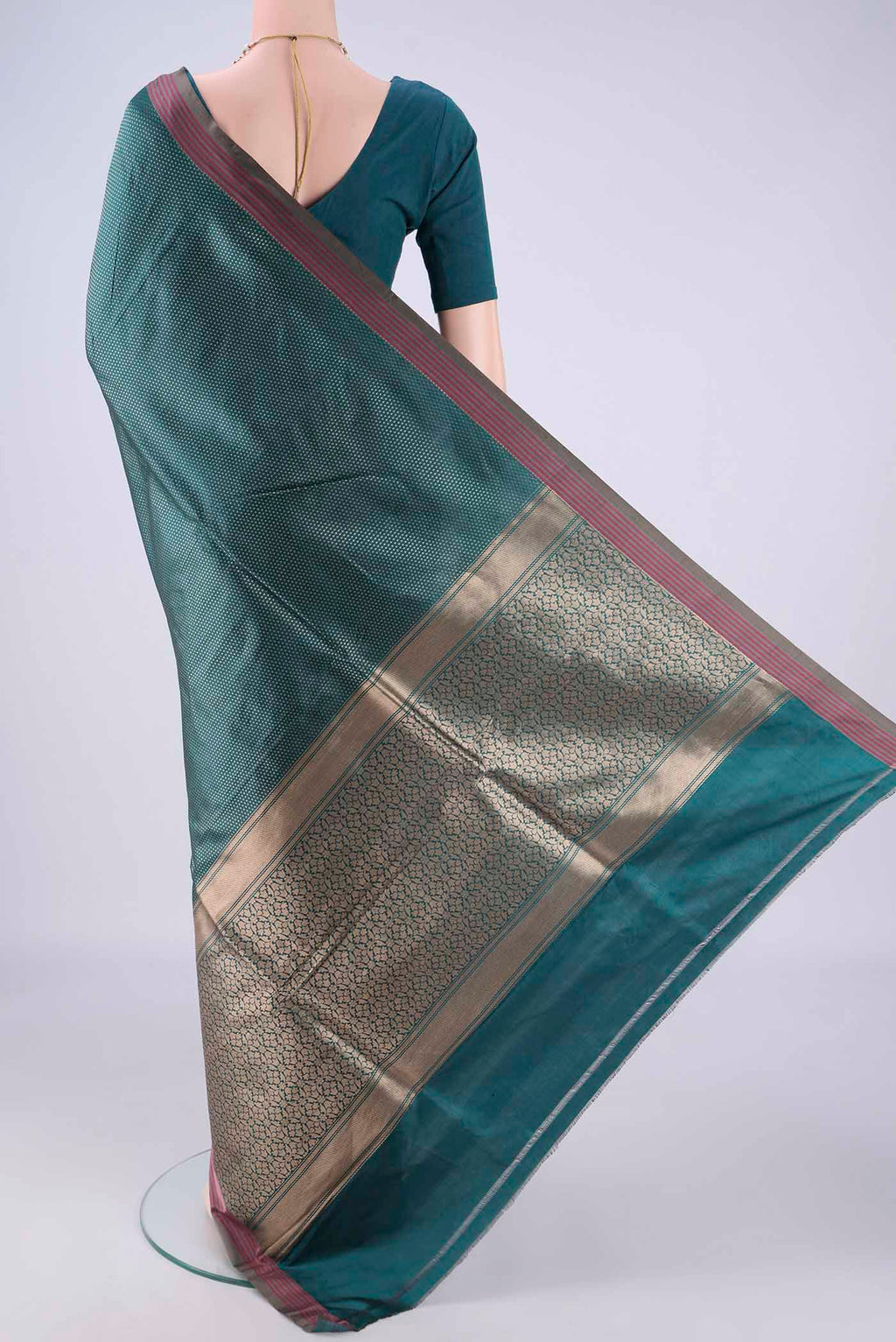 Flat view of Peacock Blue Banarasi Silk Saree with Zari Brocade on the body and Plain Border. 