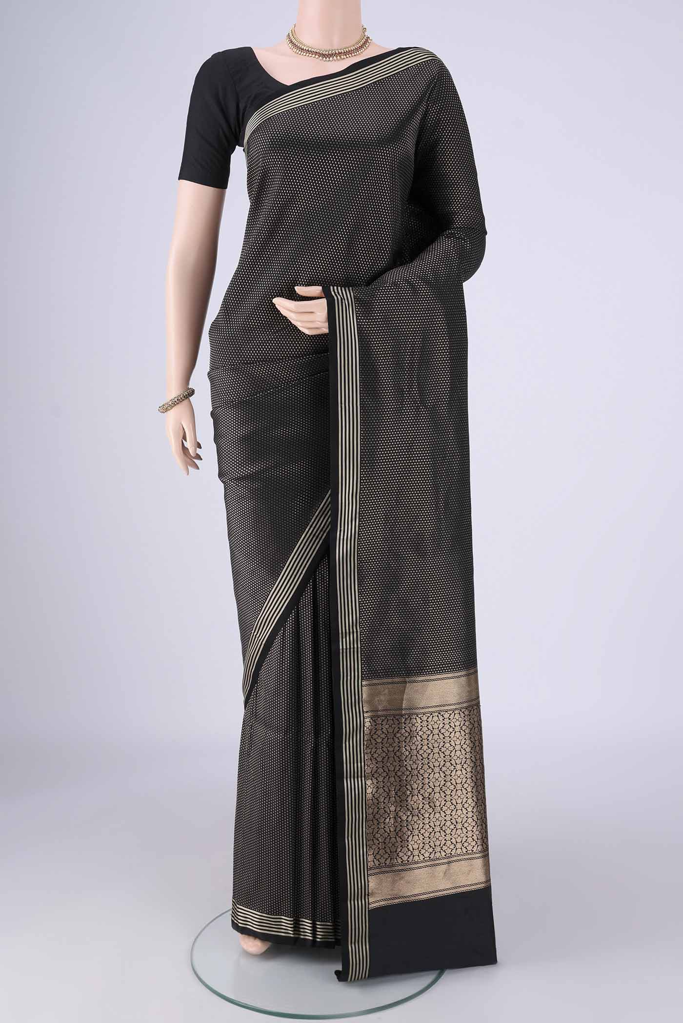 Black Banarasi Silk Saree with Zari Brocade on the body and Plain Border.  displayed on a mannequin