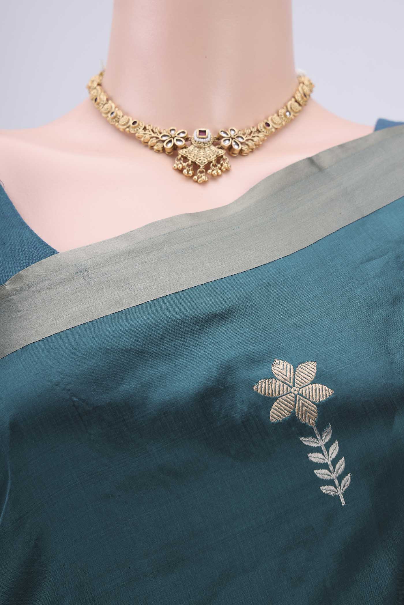 Border image of Turquoise Banarasi Silk Saree with Zari Butta on the body and Zari Border. 