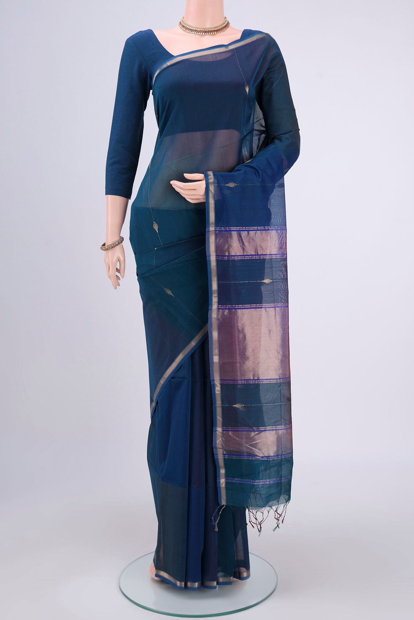 Dark Blue Dual Tone Maheshwari Silk Cotton Saree with Thread Butta on the body and Zari Border.  displayed on a mannequin