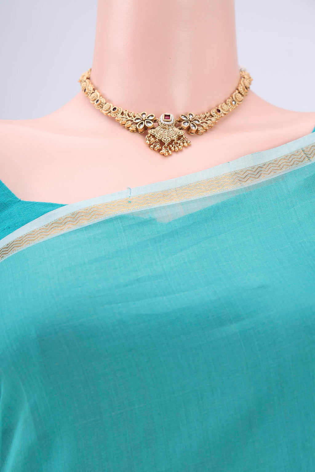 Border image of Sky Blue Maheshwari Silk Cotton Saree with Zari And Thread Butta on the body and Zari Border. 