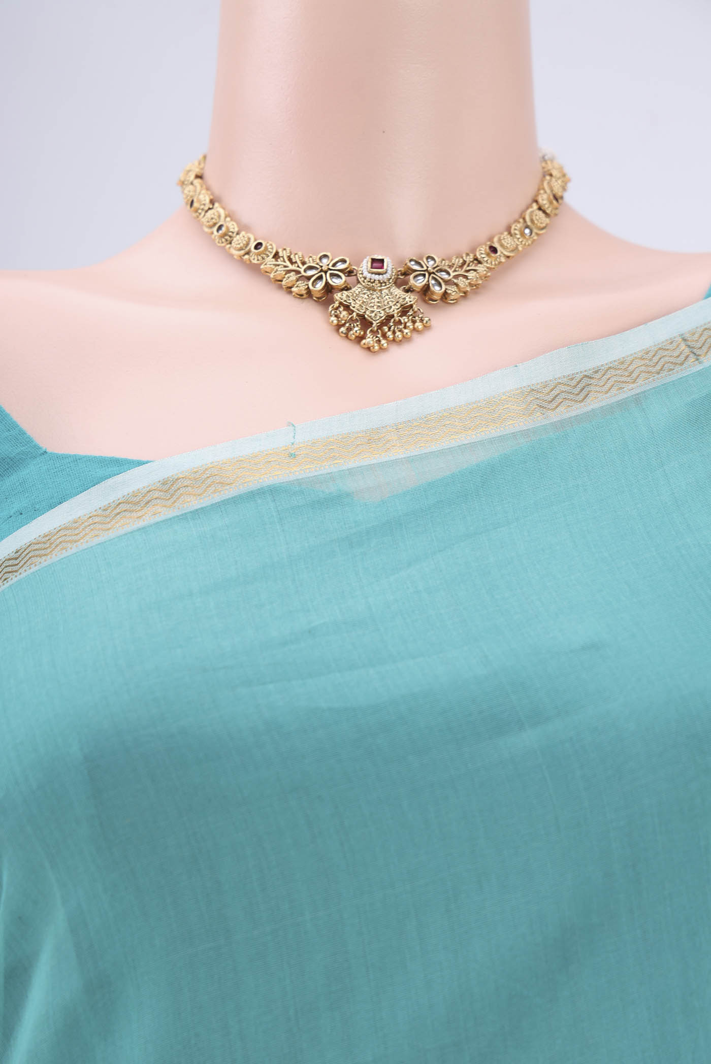 Border image of Sky Blue Maheshwari Silk Cotton Saree with Zari And Thread Butta on the body and Zari Border. 