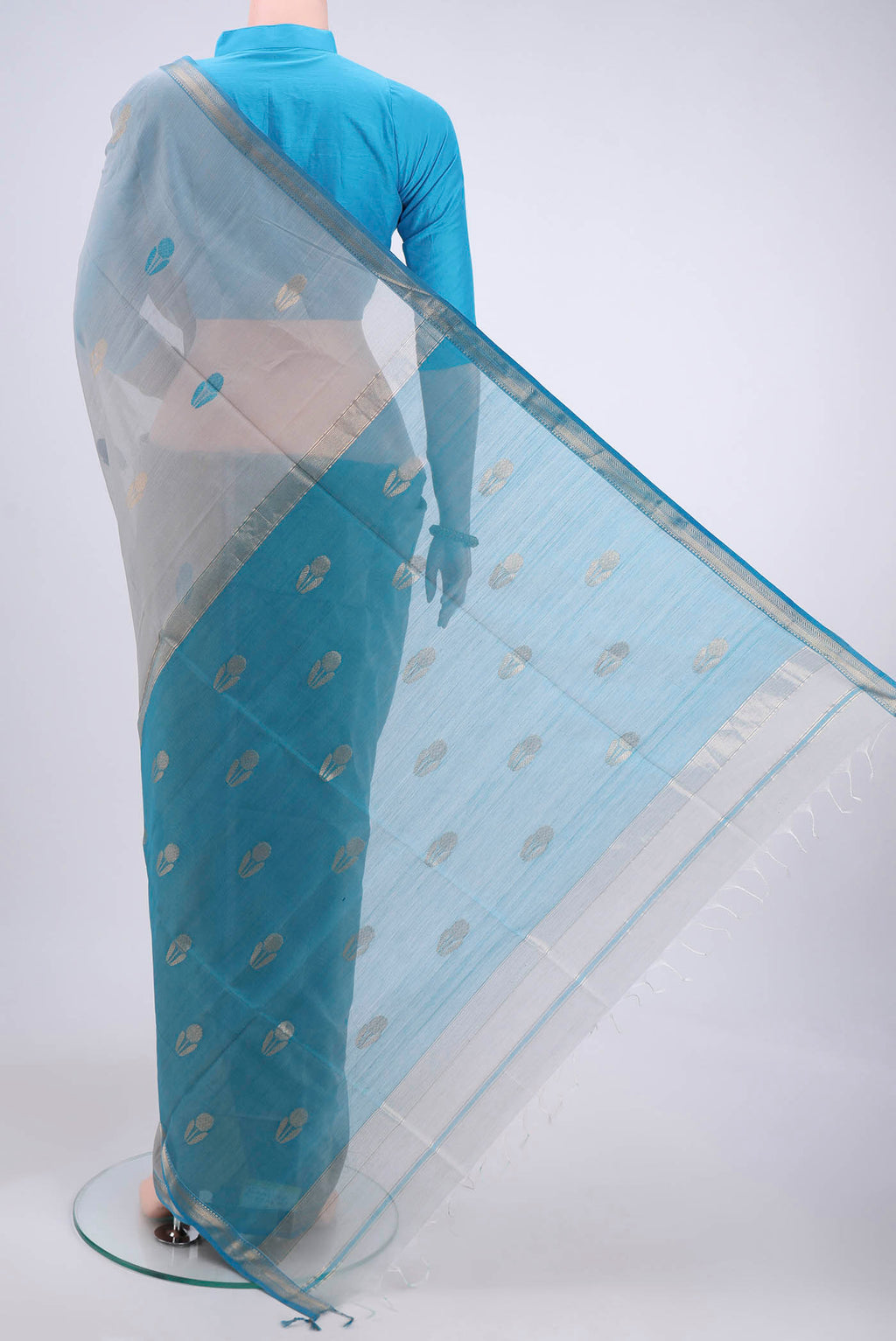 Flat view of Blue Grey Maheshwari Silk Cotton Saree with Thread Butta on the body and Zari Border. 