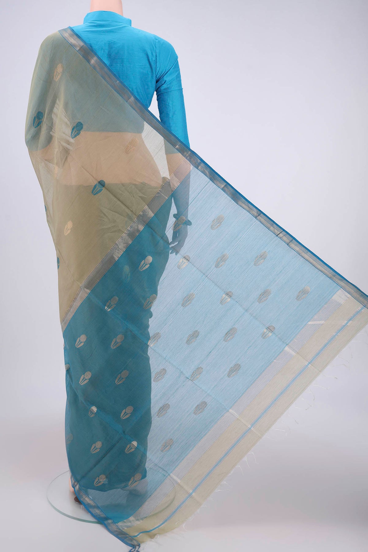 Flat view of Sage Green Maheshwari Silk Cotton Saree with Zari And Thread Butta on the body and Zari And Thread Border. 