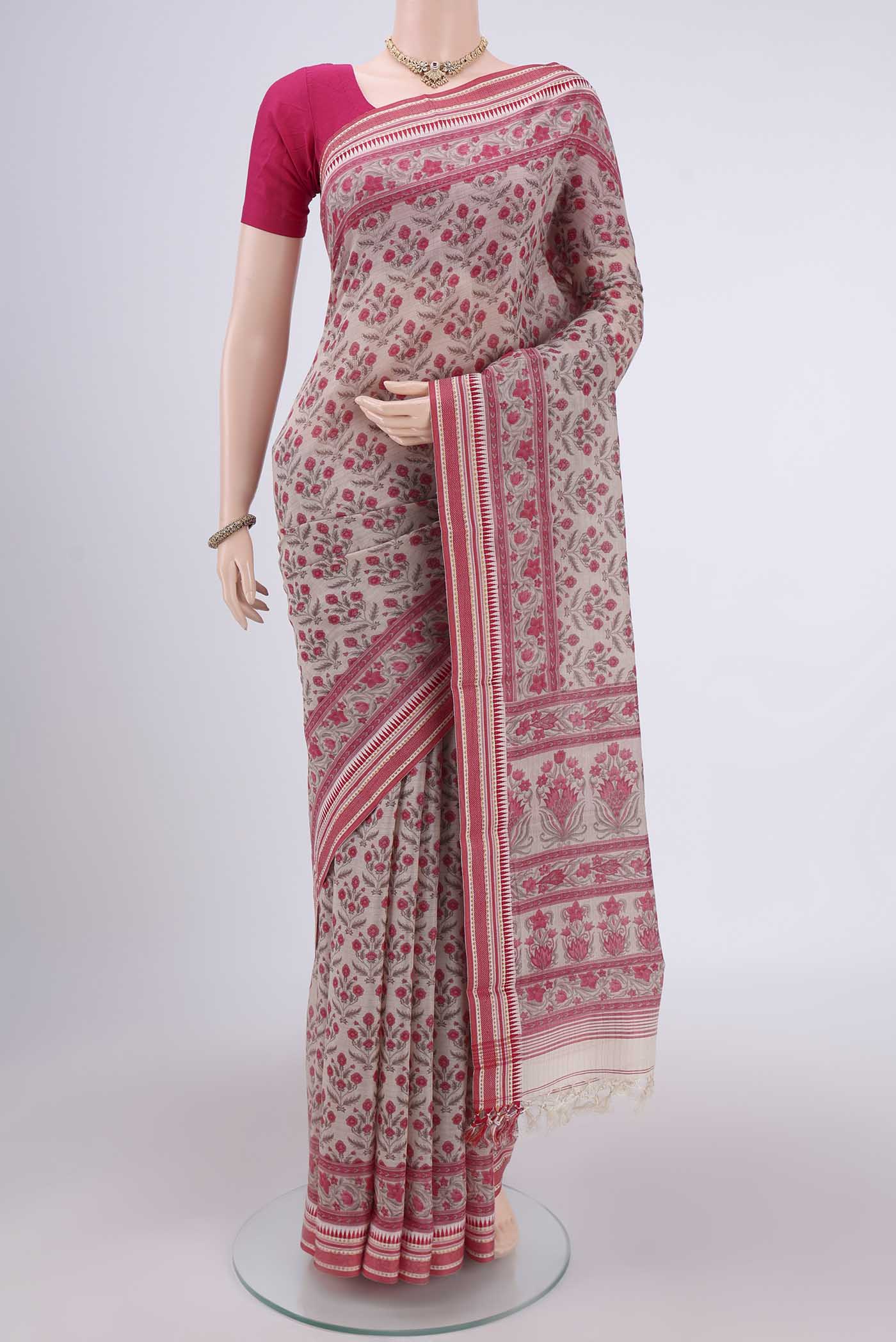 Beige Tussar Silk Saree with Floral Print on the body and Thread Border.  displayed on a mannequin