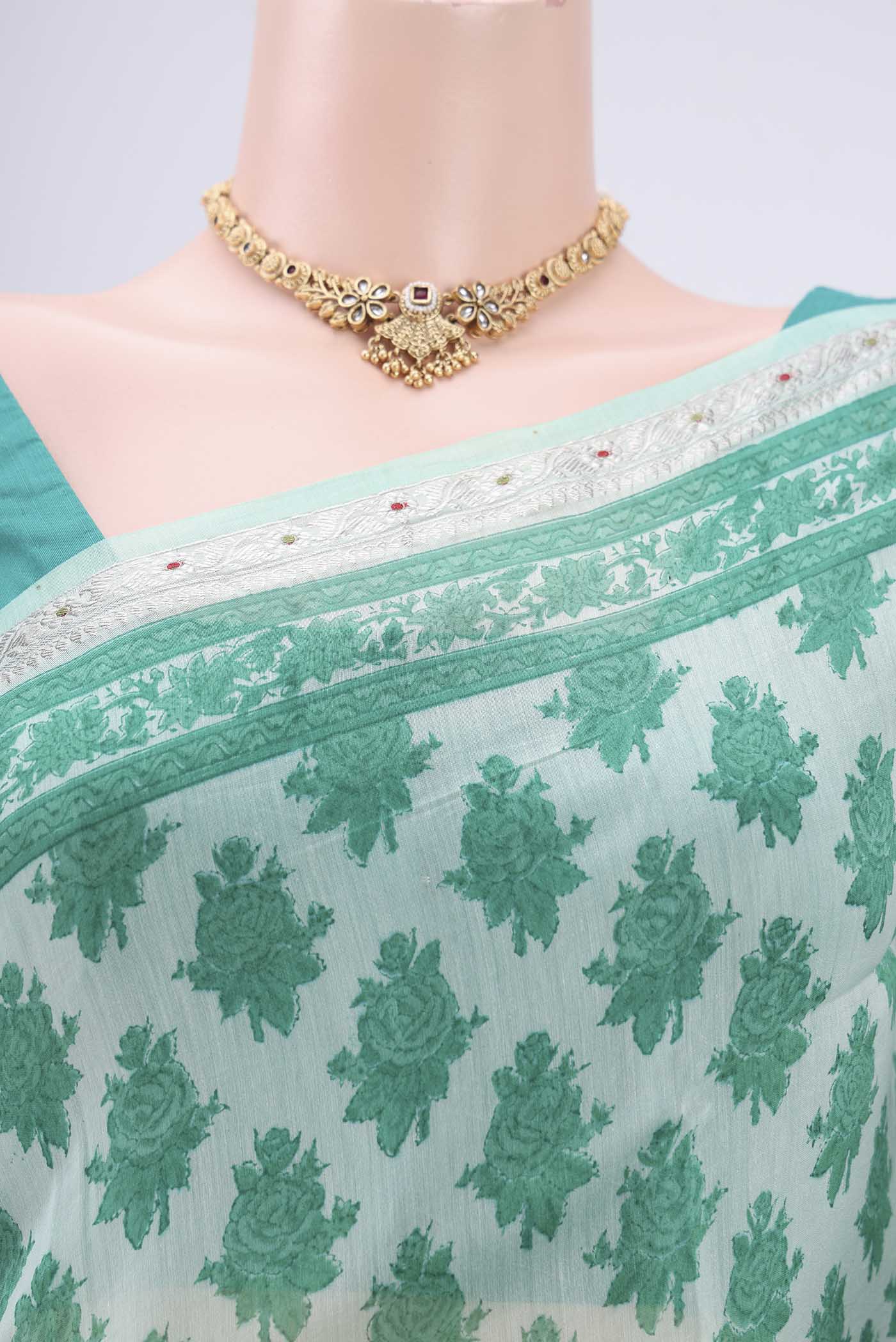 Border image of Mint Green Chanderi Silk Saree with Floral Print on the body and Zari Border. 