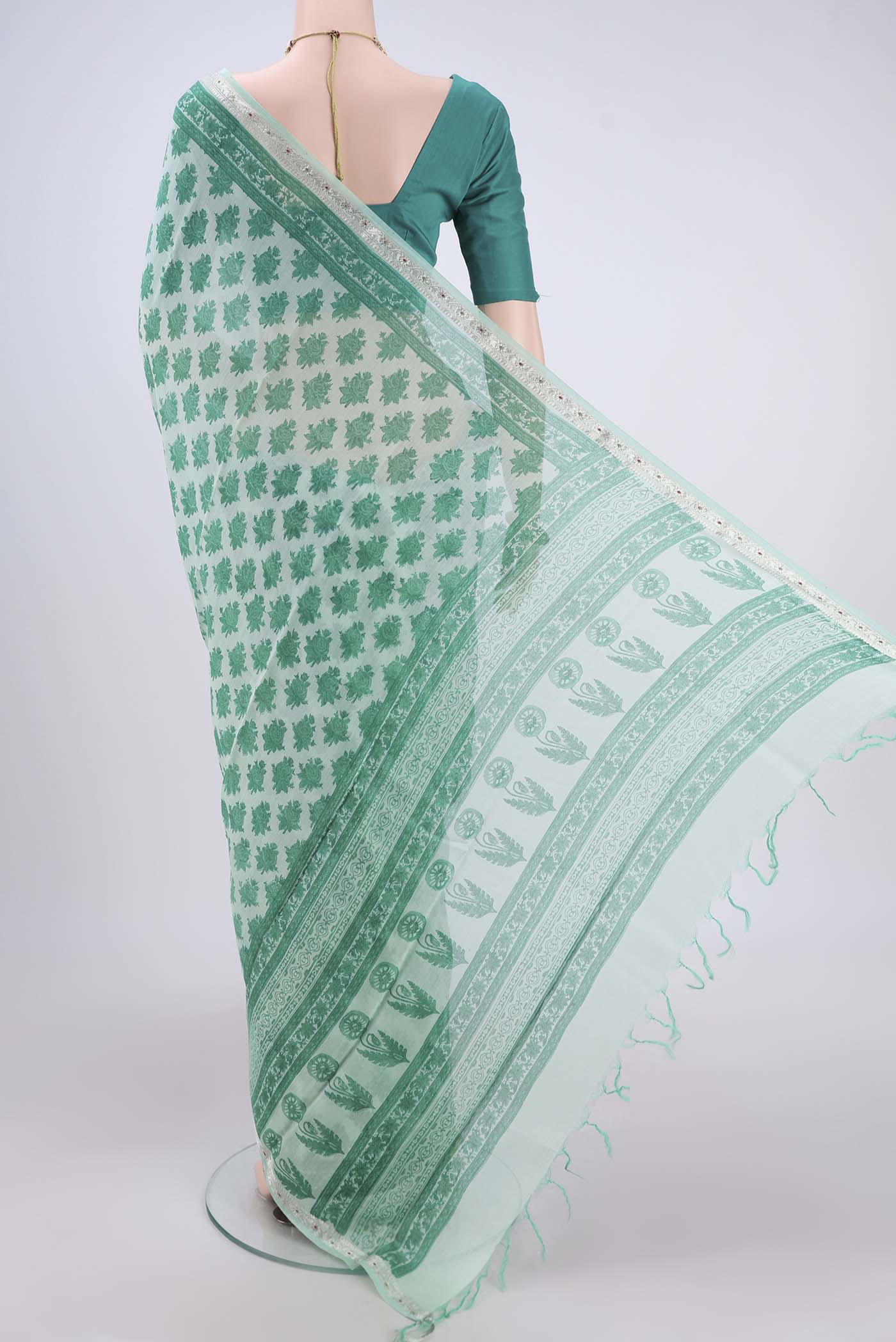 Flat view of Mint Green Chanderi Silk Saree with Floral Print on the body and Zari Border. 