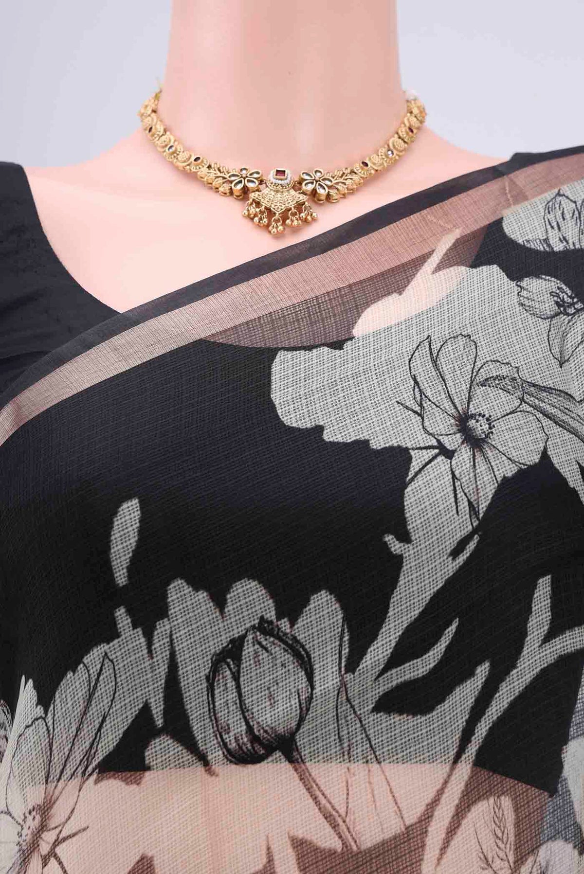 Border image of Black Kota Silk Saree with Printed design on the body and Zari Border. 