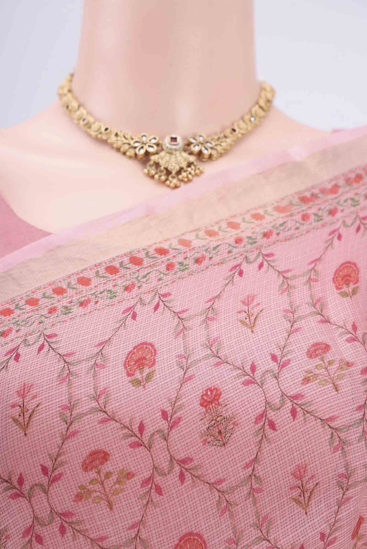 Border image of Peach Kota Silk Saree with Printed design on the body and Zari Border. 