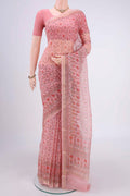 Peach Kota Silk Saree with Printed design on the body and Zari Border.  displayed on a mannequin