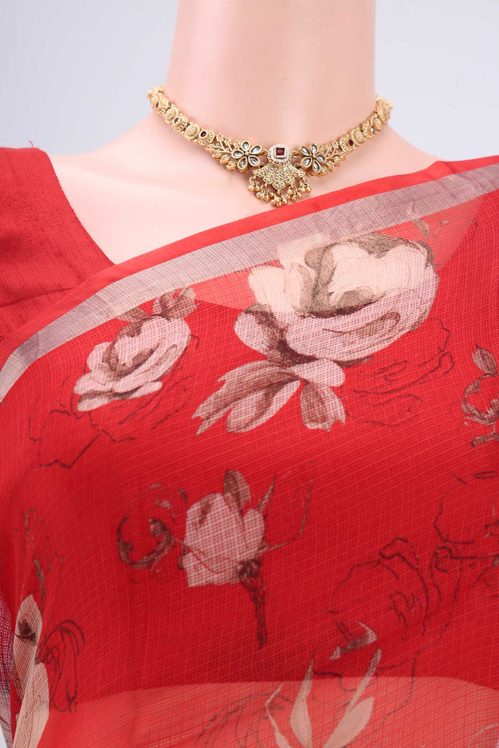 Border image of Red Kota Silk Saree with Floral Print on the body and Zari Border. 