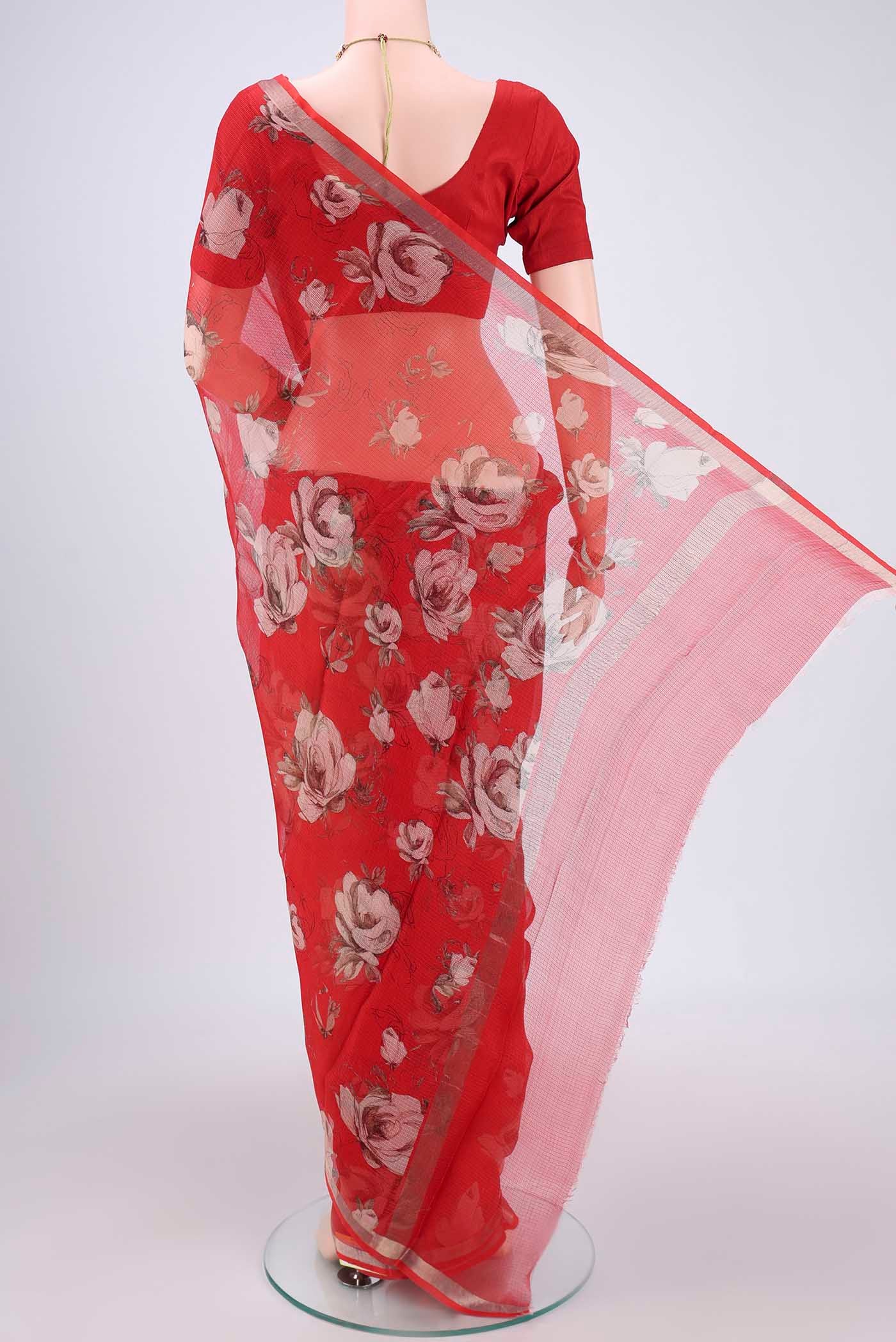 Flat view of Red Kota Silk Saree with Floral Print on the body and Zari Border. 