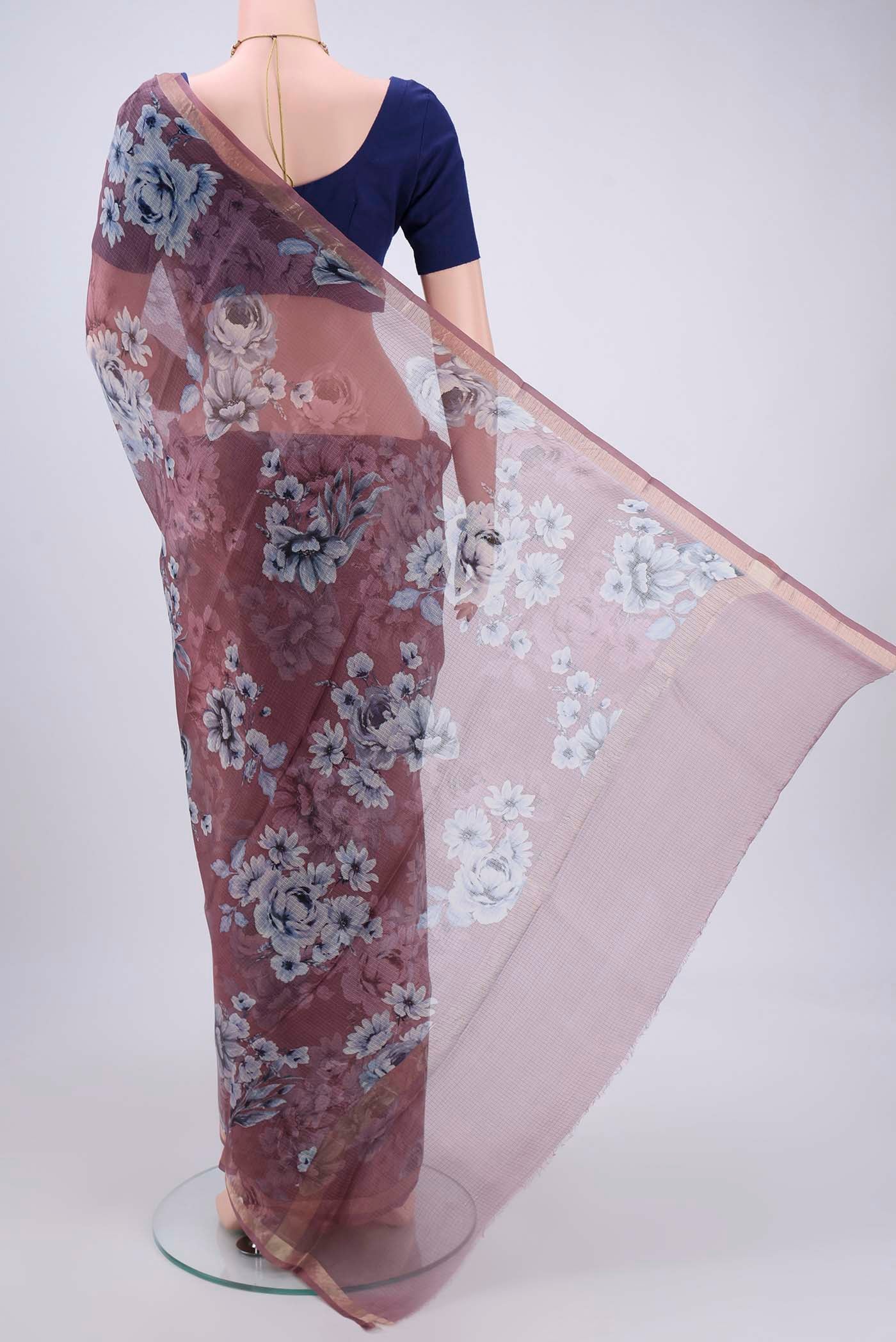 Flat view of Coral Kota Silk Saree with Printed design on the body and Zari Border. 