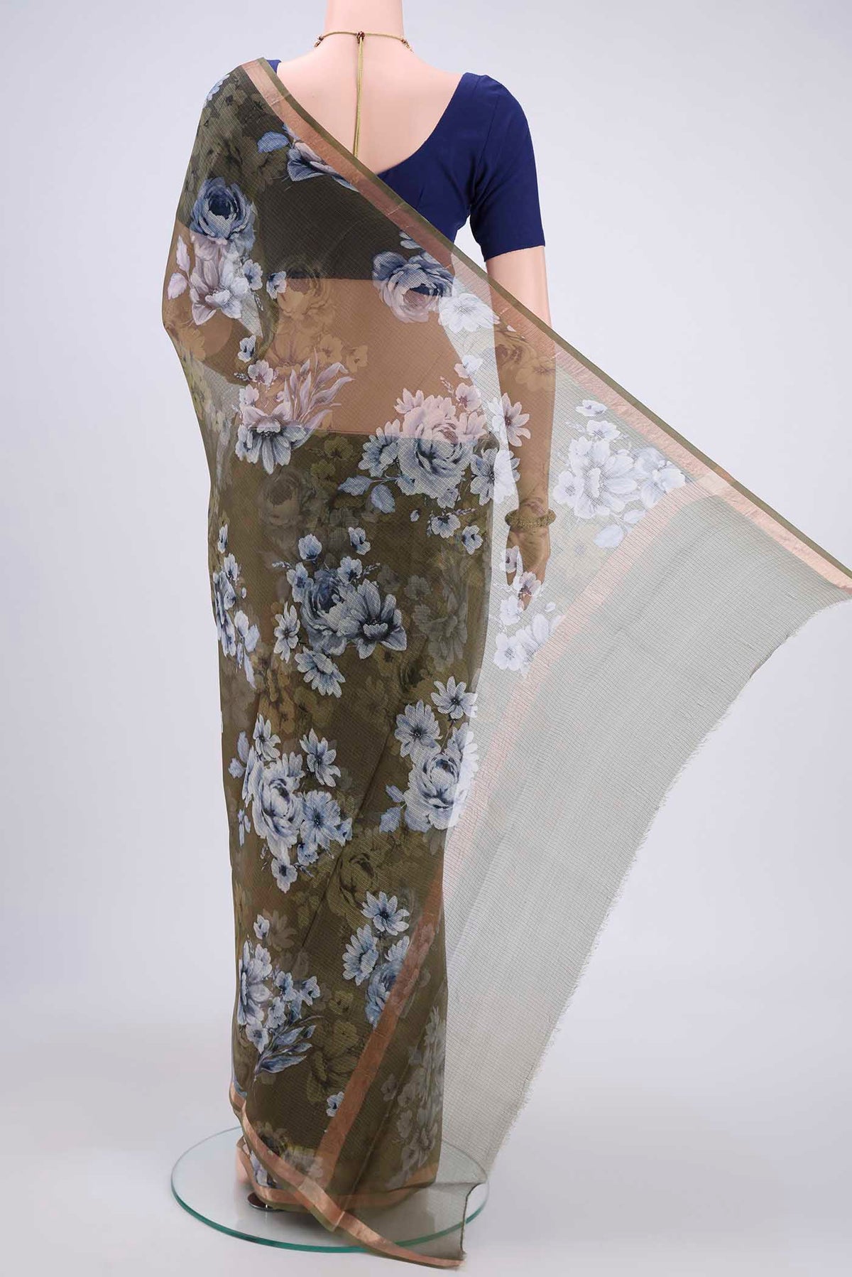 Flat view of Mehandi Green Kota Silk Saree with Printed design on the body and Zari Border. 