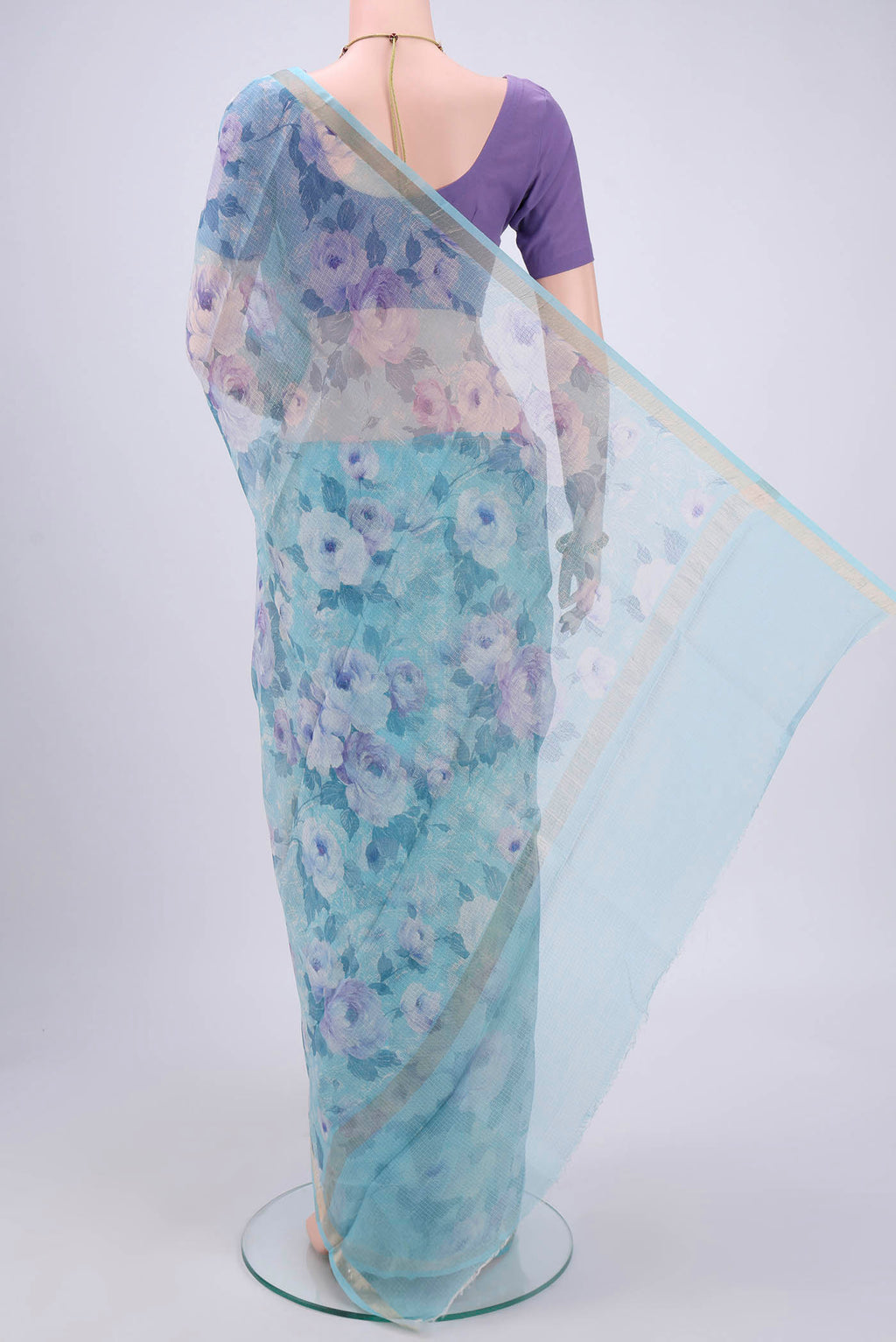 Flat view of Sky Blue Kota Silk Saree with Printed design on the body and Zari Border. 