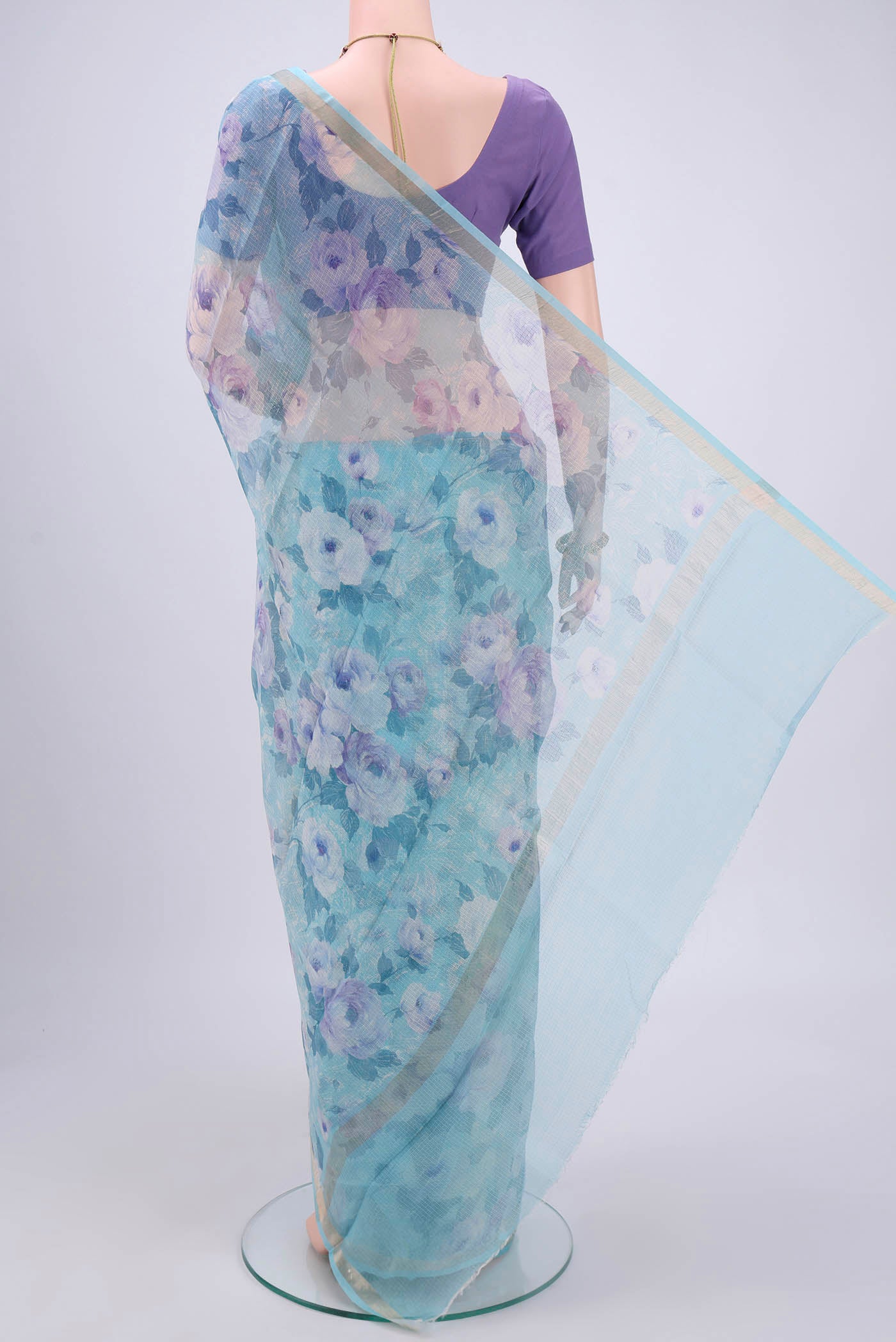 Flat view of Sky Blue Kota Silk Saree with Printed design on the body and Zari Border. 