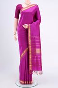 Magenta Kanjivaram Silk Saree with Plain Body and Zari Border.  displayed on a mannequin