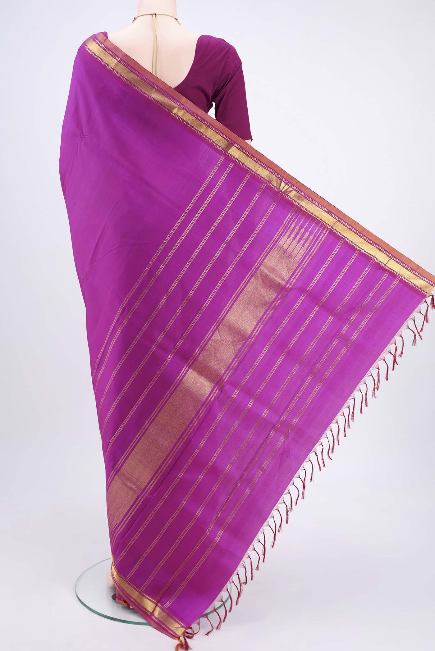 Flat view of Magenta Kanjivaram Silk Saree with Plain Body and Zari Border. 