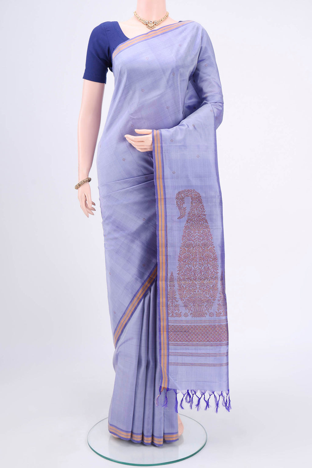 Violet Kanchipuram Silk Saree with Zari Butta on the body and Plain Border.  displayed on a mannequin