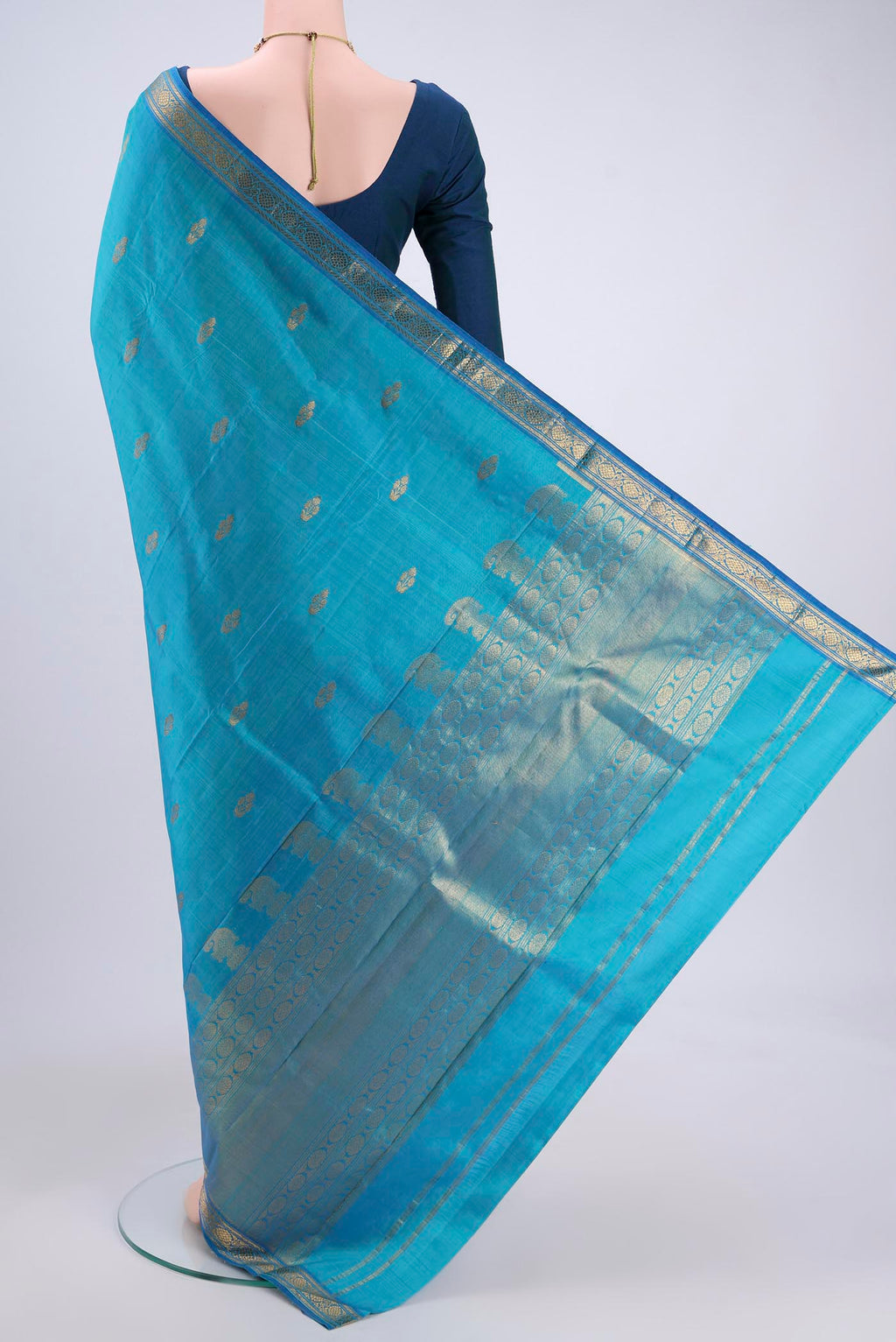 Flat view of Blue Kanjivaram Silk Saree with Zari Butta on the body and Zari Border. 